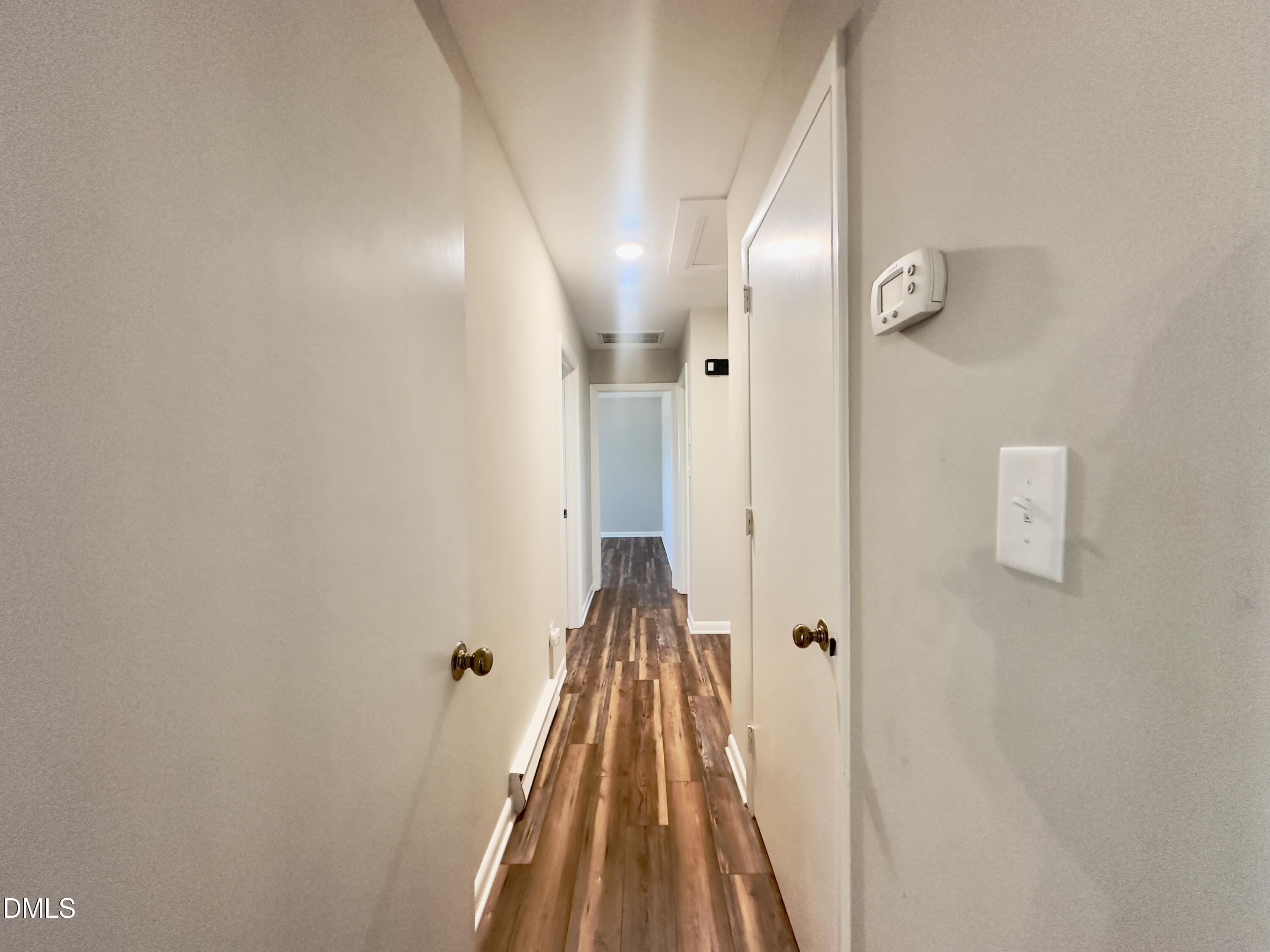 405 North Main Street Wake Forest, NC 27587 - Photo 12 of 21 a view of a hallway with wooden floor