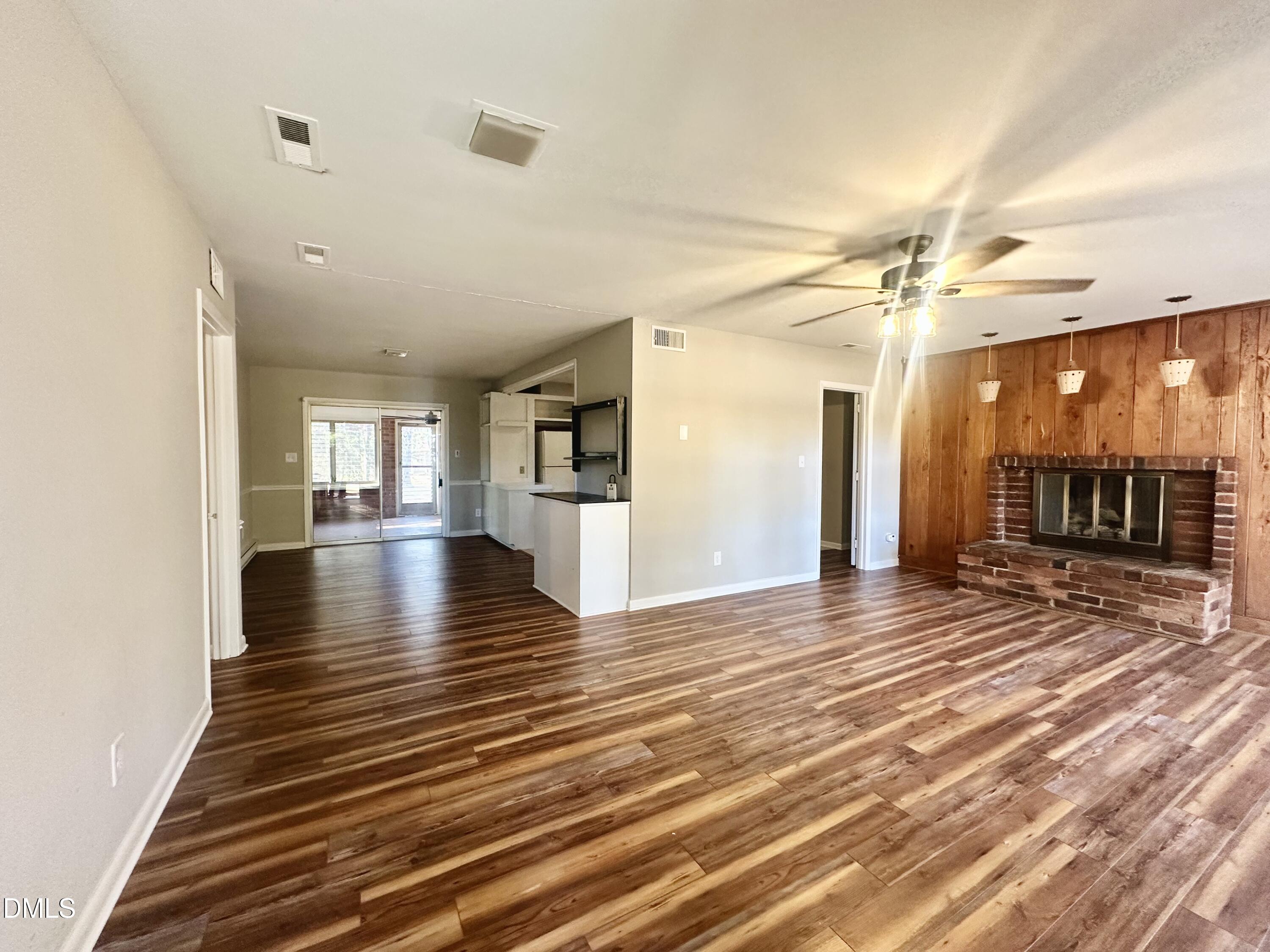 405 North Main Street Wake Forest, NC 27587 - Photo 6 of 21 a view of a room with wooden floor