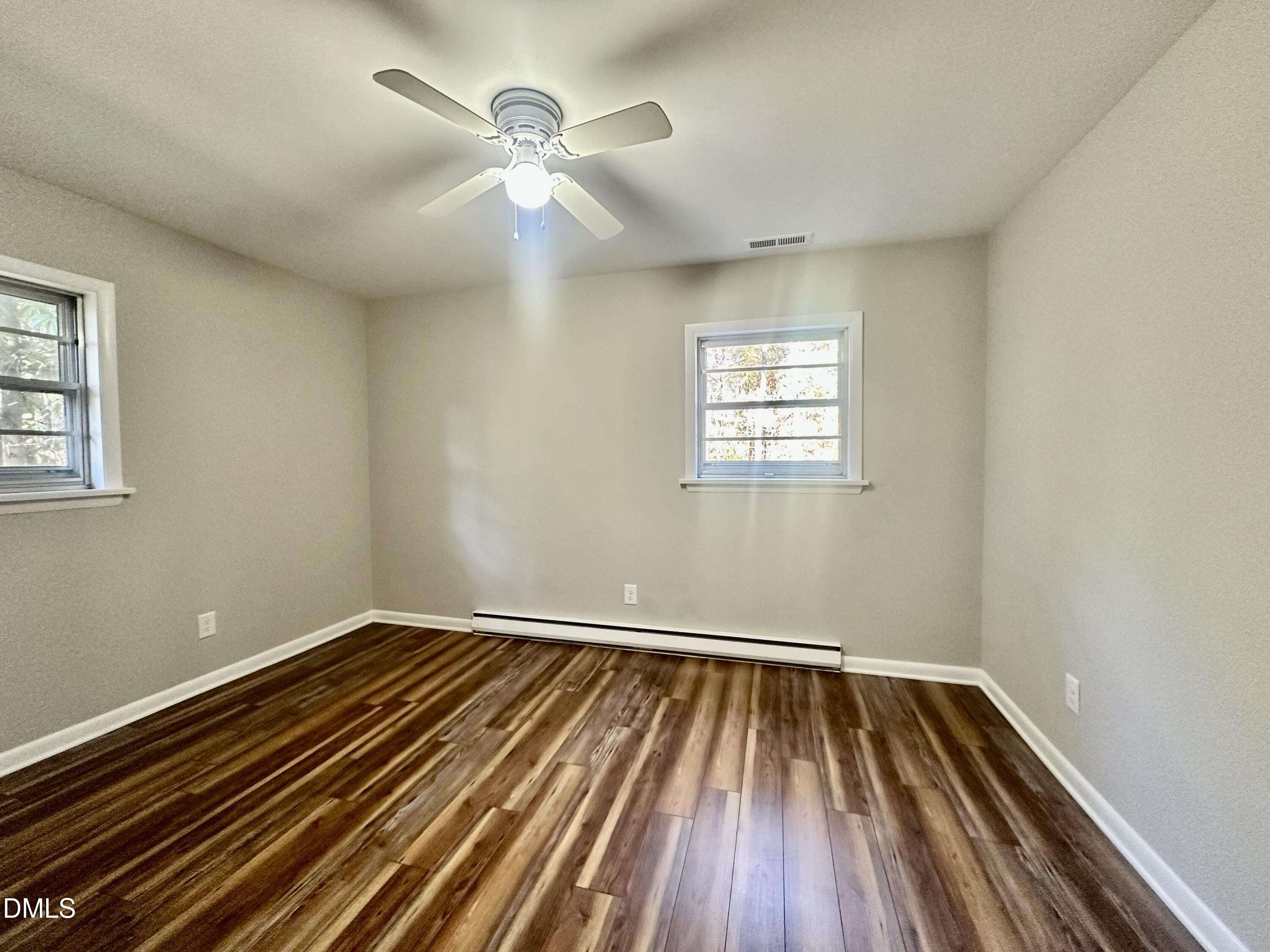 405 North Main Street Wake Forest, NC 27587 - Photo 9 of 21 wooden floor in an empty room with a window