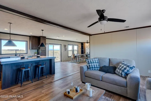 a view of kitchen with furniture and wooden floor