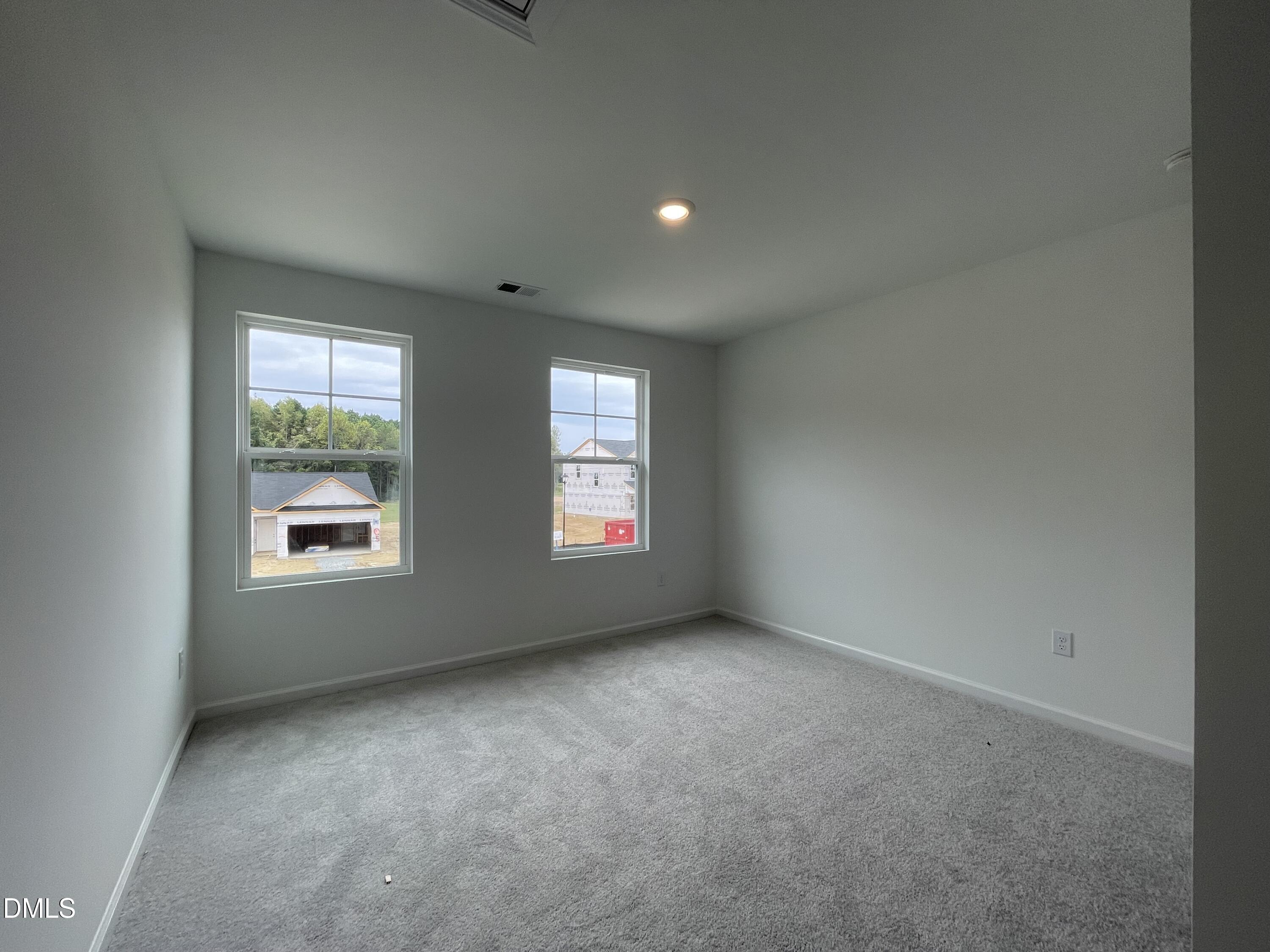66 Digging Time Avenue Princeton, NC 27569 - Photo 15 of 47 an empty room with windows