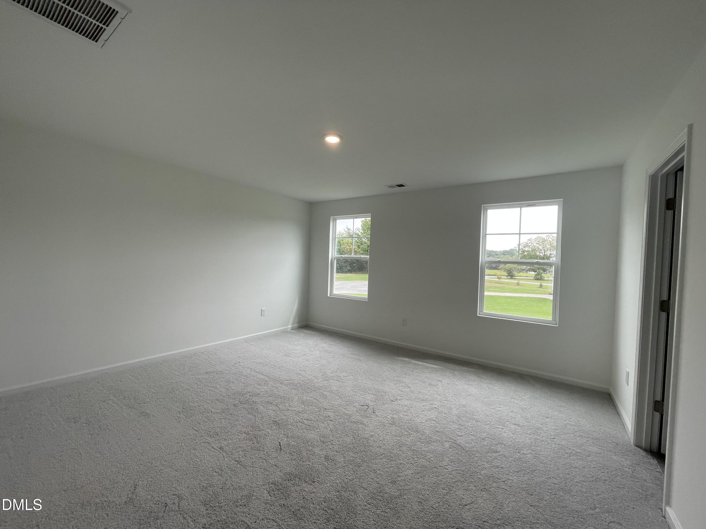 66 Digging Time Avenue Princeton, NC 27569 - Photo 16 of 47 an empty room with windows
