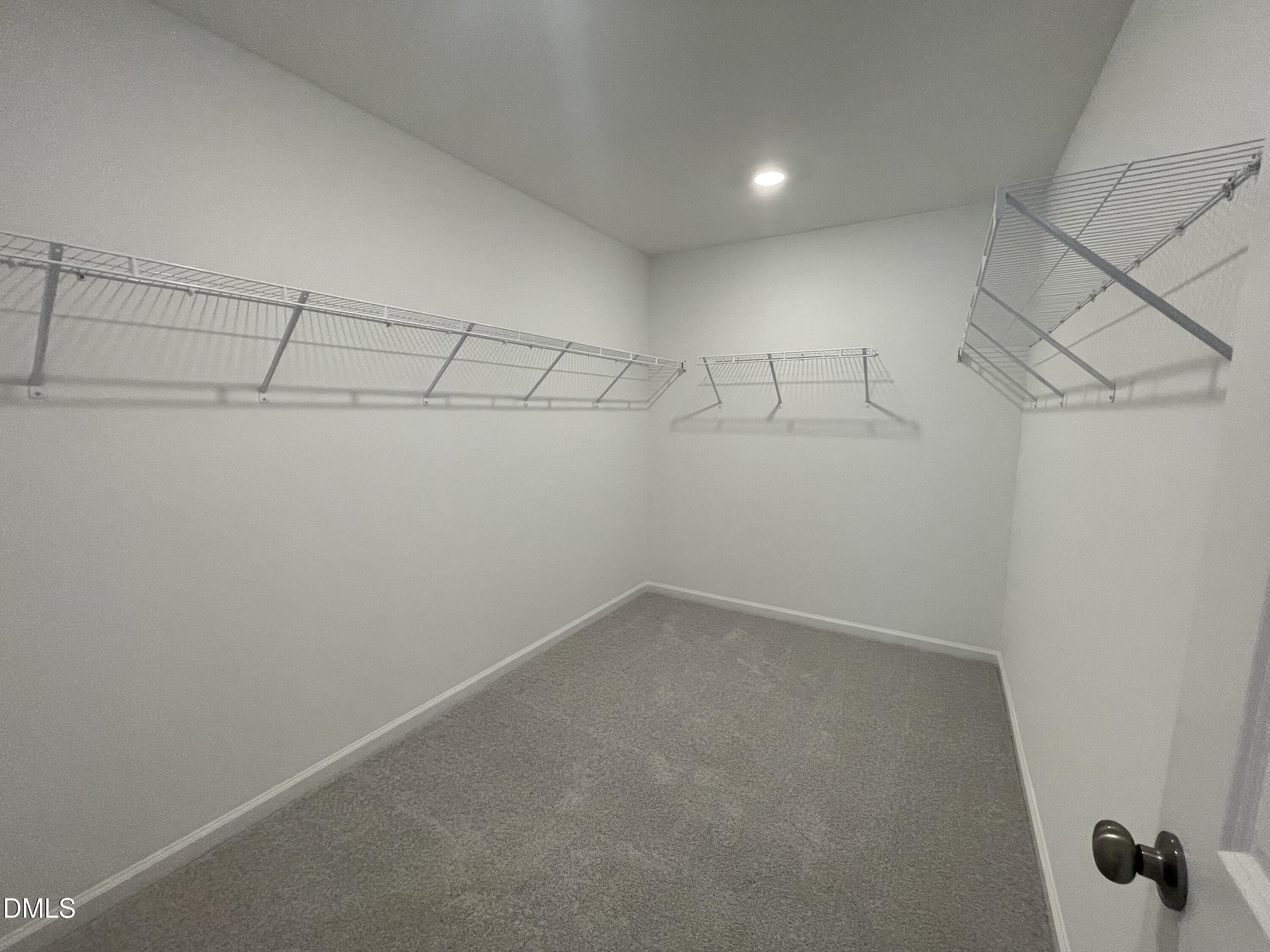 66 Digging Time Avenue Princeton, NC 27569 - Photo 19 of 47 a view of a room with racks on the wall