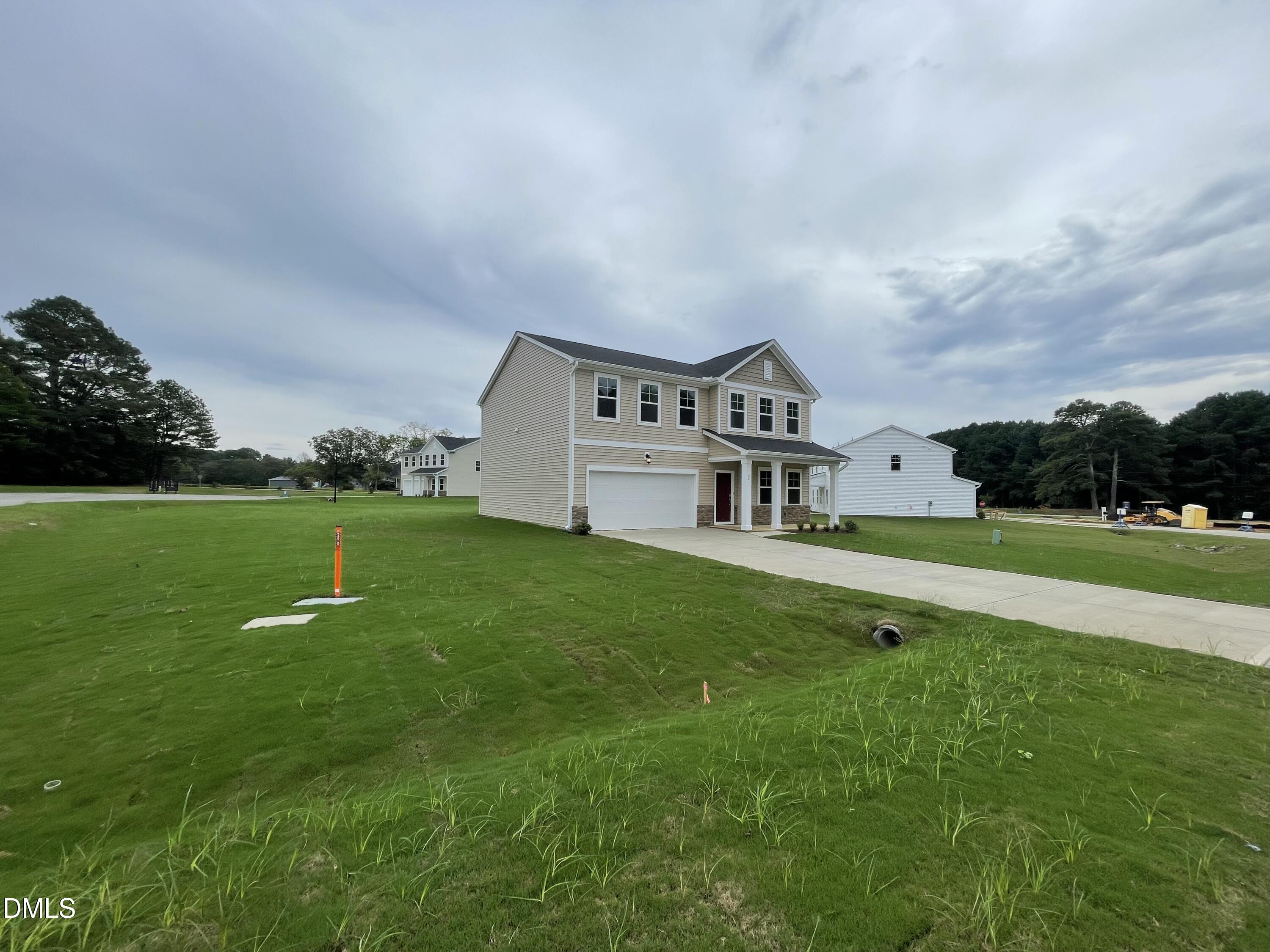 66 Digging Time Avenue Princeton, NC 27569 - Photo 2 of 47 a view of a house with a big yard and potted plants