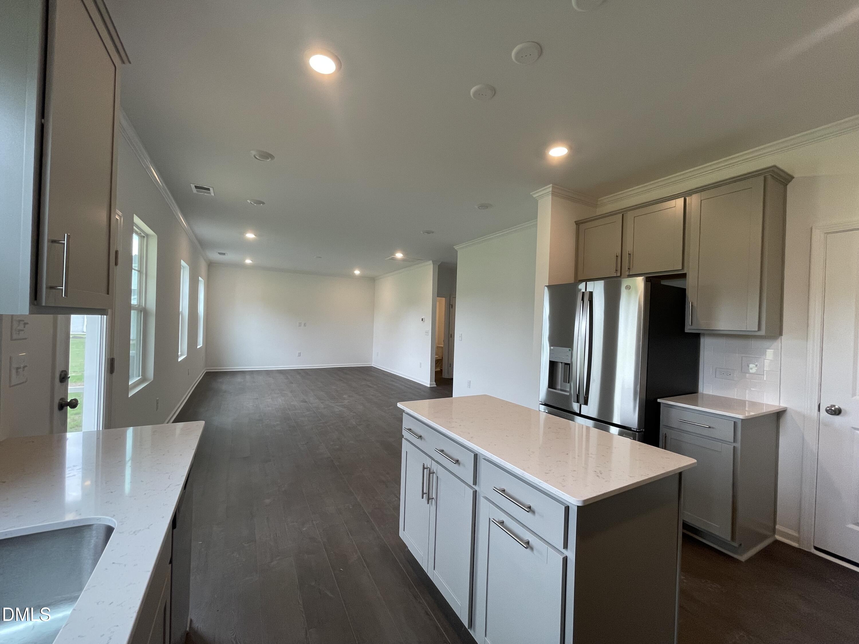 66 Digging Time Avenue Princeton, NC 27569 - Photo 3 of 47 a kitchen with stainless steel appliances a refrigerator and a stove