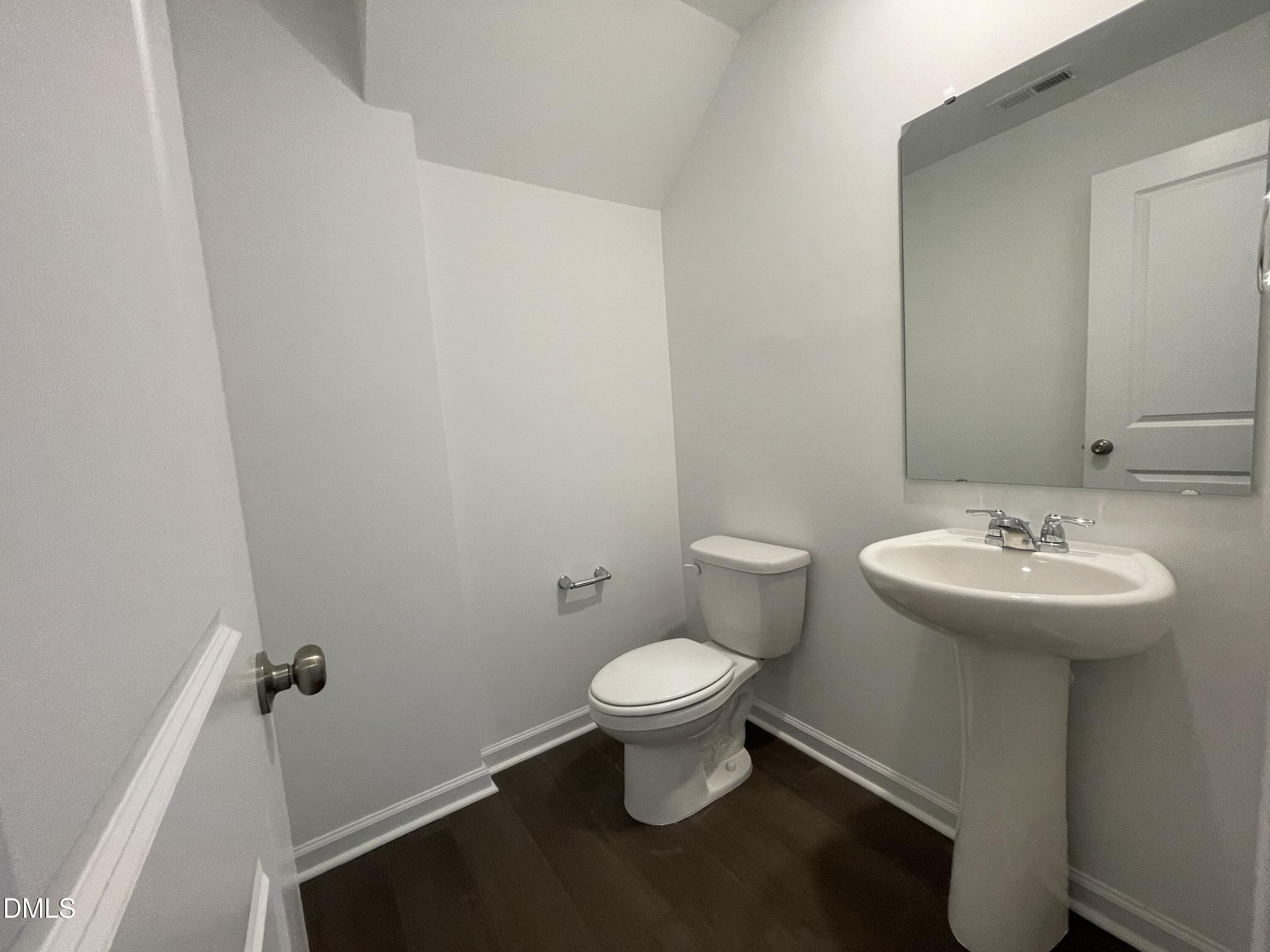 66 Digging Time Avenue Princeton, NC 27569 - Photo 7 of 47 a bathroom with a sink toilet and a mirror