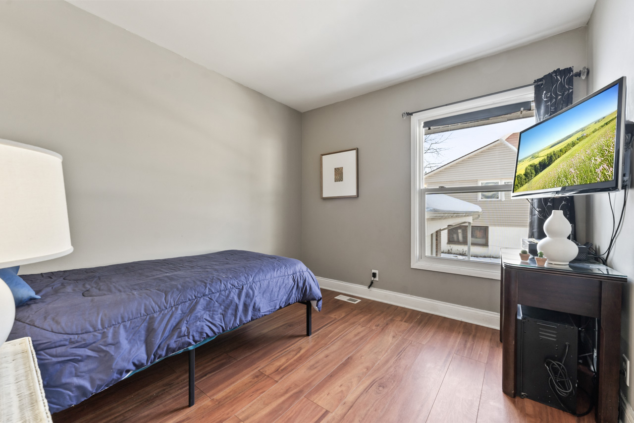 727 Lacy Avenue Streamwood, IL 60107 - Photo 14 of 30 a living room with a bed furniture and a window