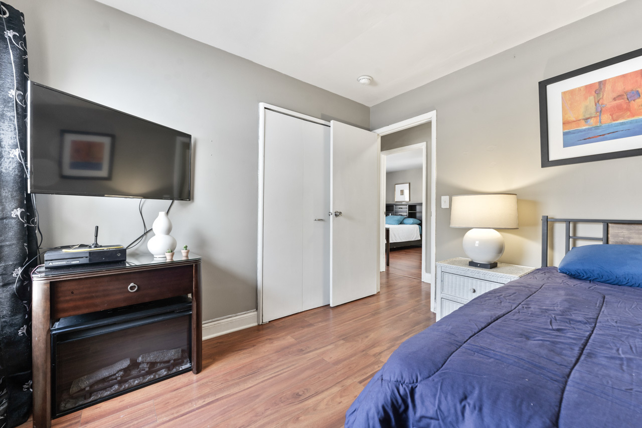 727 Lacy Avenue Streamwood, IL 60107 - Photo 15 of 30 a bedroom with a bed and wooden floor