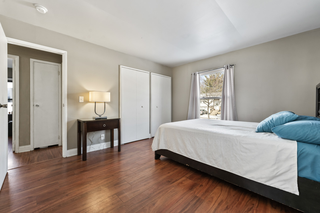 727 Lacy Avenue Streamwood, IL 60107 - Photo 19 of 30 a bedroom with a bed and a table