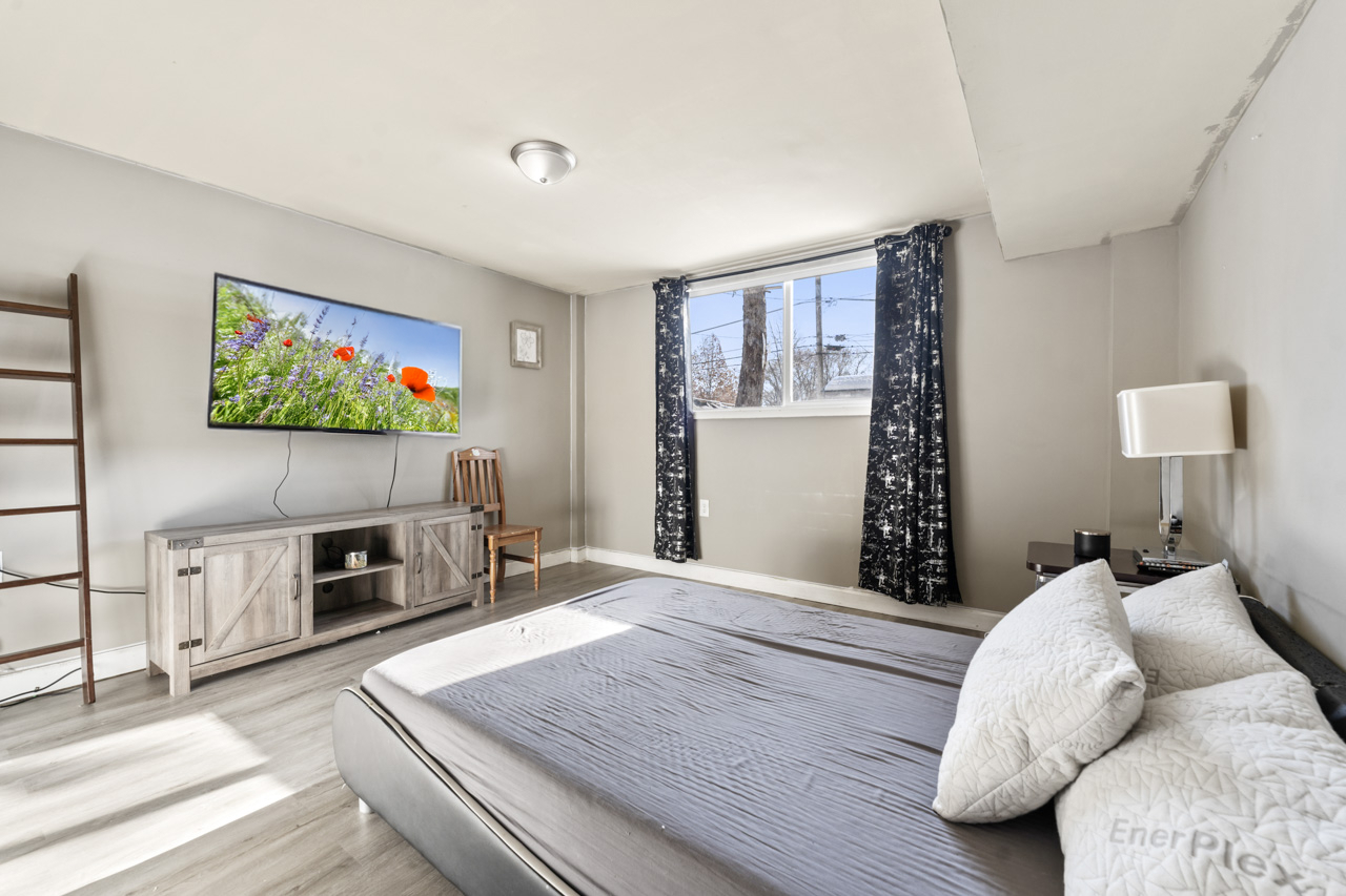 727 Lacy Avenue Streamwood, IL 60107 - Photo 24 of 30 a bedroom with a bed and a flat screen tv