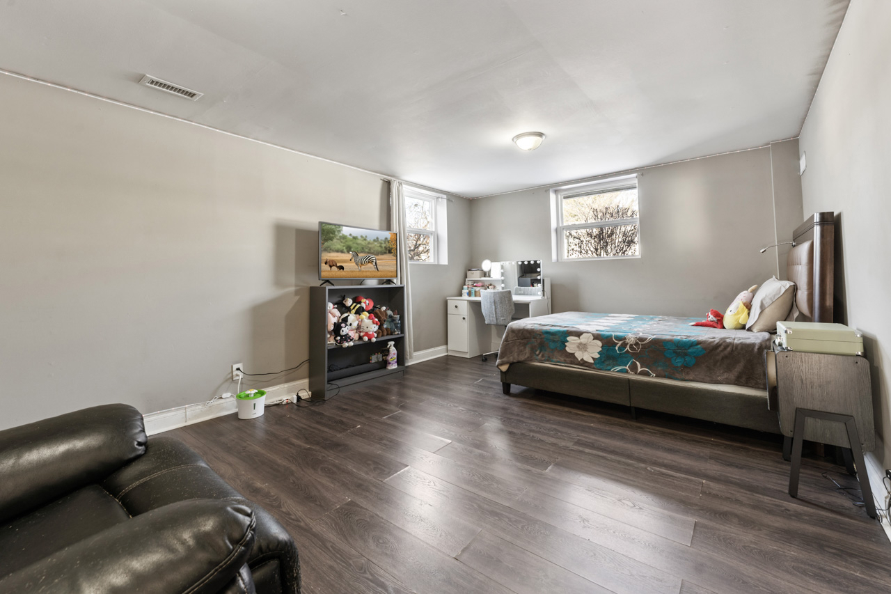727 Lacy Avenue Streamwood, IL 60107 - Photo 26 of 30 a bedroom with furniture and a wooden floor