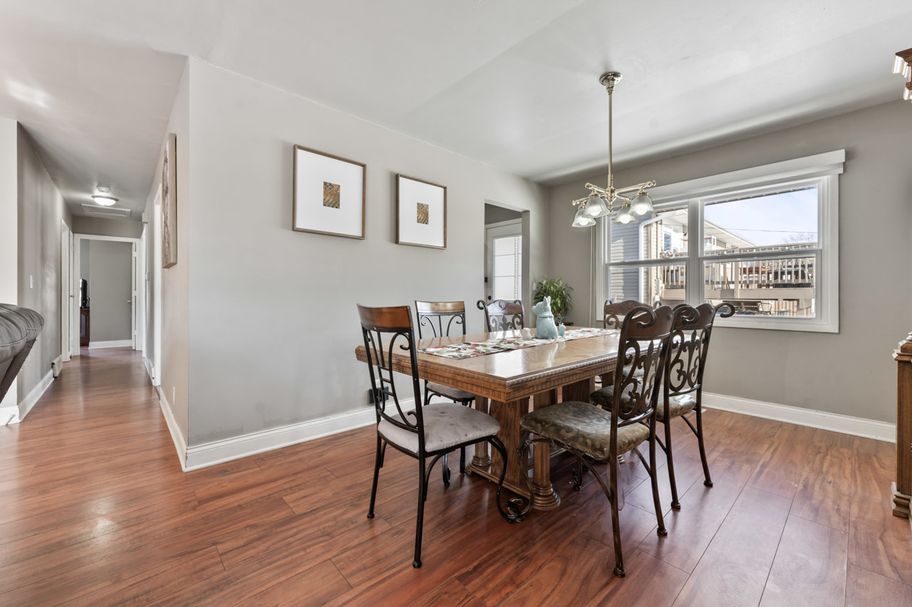 727 Lacy Avenue Streamwood, IL 60107 - Photo 7 of 30 a view of a dining room with furniture window and wooden floor