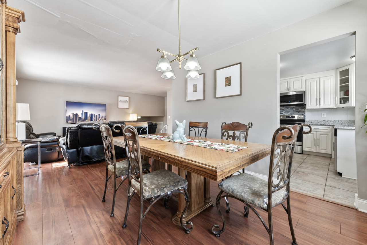727 Lacy Avenue Streamwood, IL 60107 - Photo 8 of 30 a view of a dining room with furniture and wooden floor