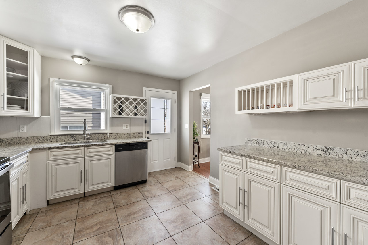 727 Lacy Avenue Streamwood, IL 60107 - Photo 9 of 30 a kitchen with a sink and cabinets