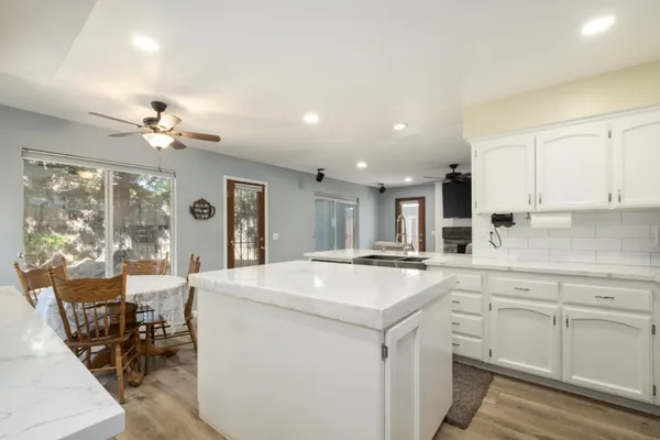 a kitchen with a sink stove and cabinets