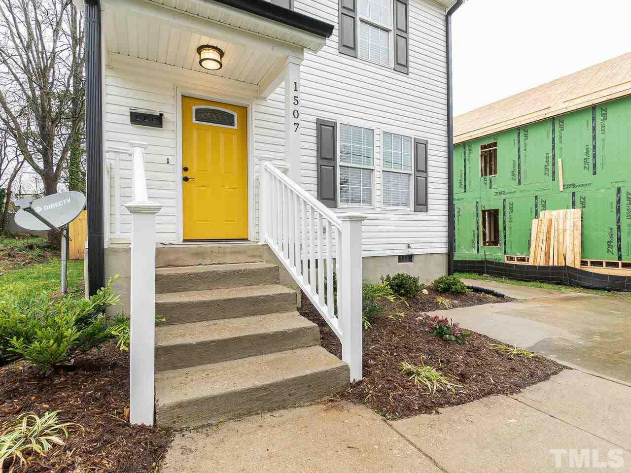1507 Pender Street Raleigh, NC 27610 - Photo 2 of 30 a view of a house with large windows and plants