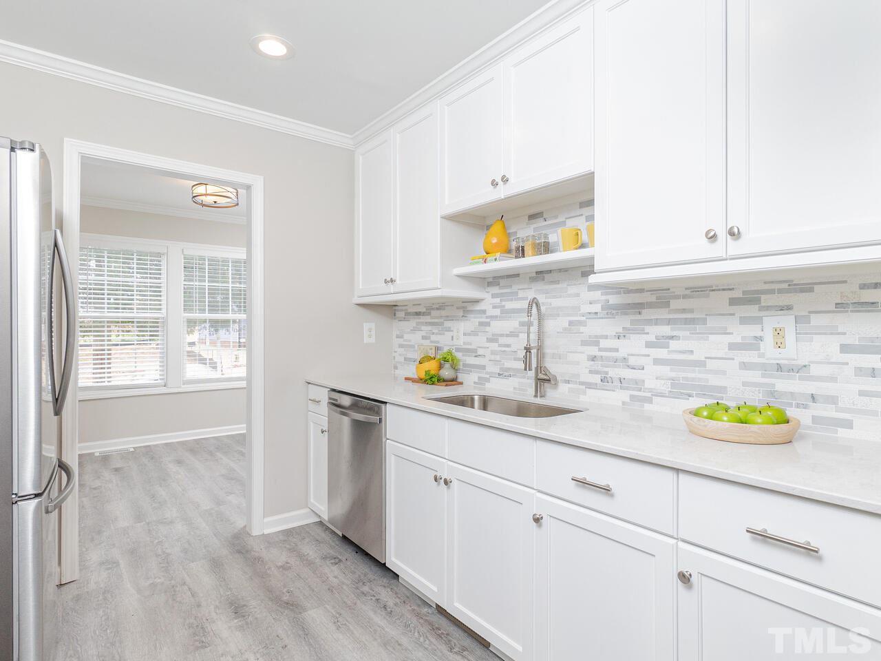 1507 Pender Street Raleigh, NC 27610 - Photo 12 of 30 a kitchen with a sink and a window