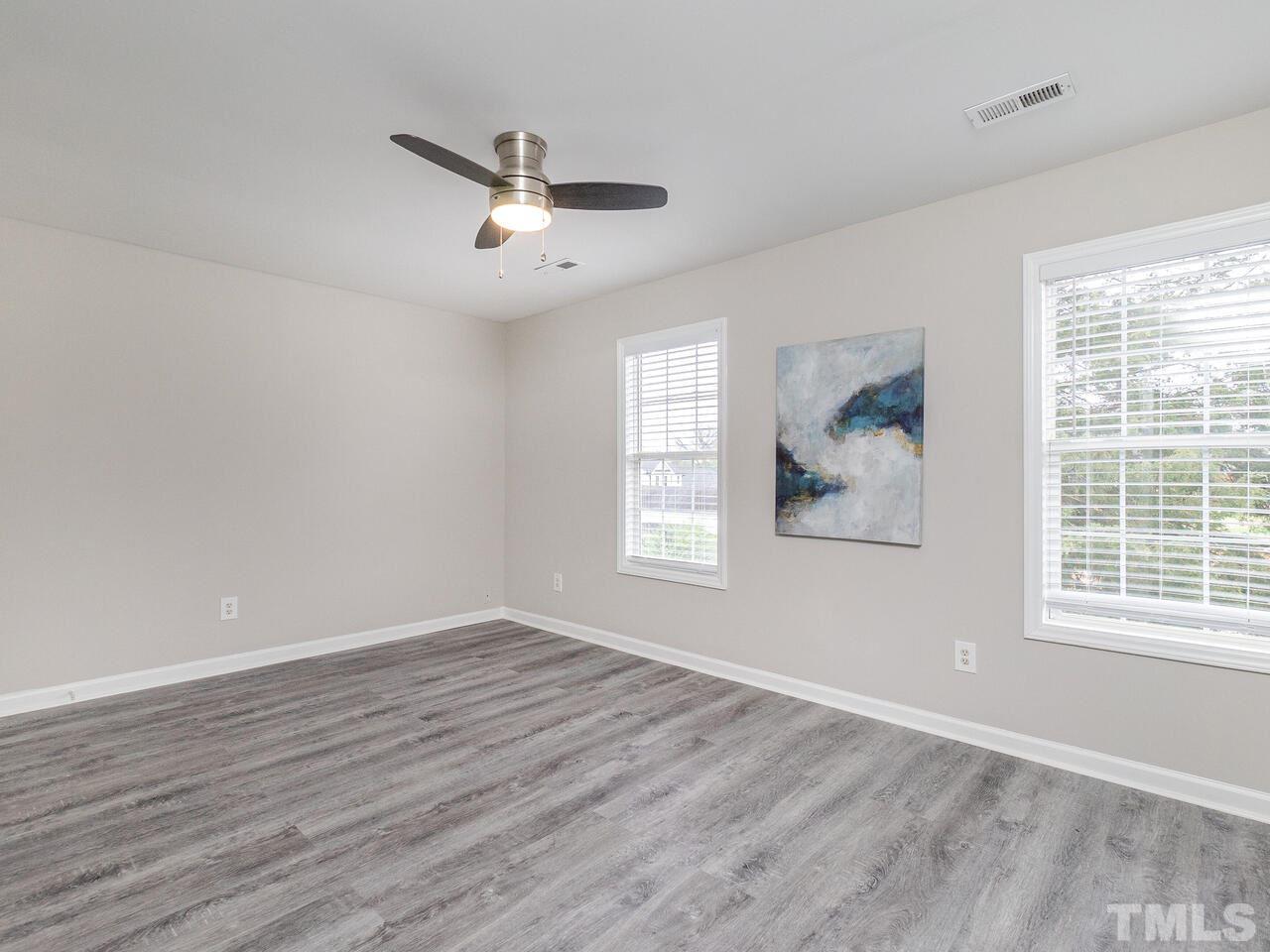 1507 Pender Street Raleigh, NC 27610 - Photo 20 of 30 wooden floor in an empty room with a window