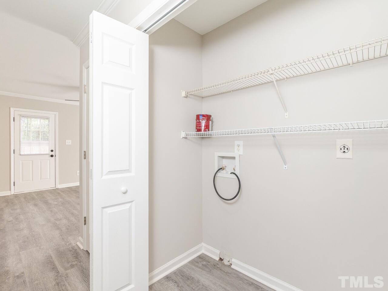 1507 Pender Street Raleigh, NC 27610 - Photo 5 of 30 a view of storage and utility room with racks on the wall