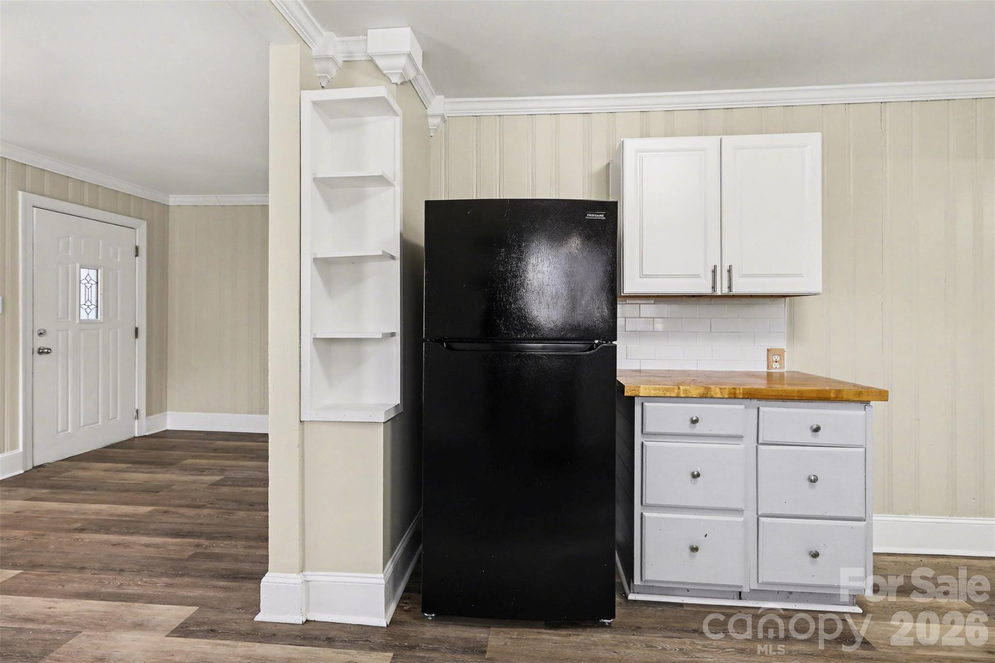 614 North Rhyne Street Gastonia, NC 28054 - Photo 14 of 29 a kitchen with a refrigerator and cabinets