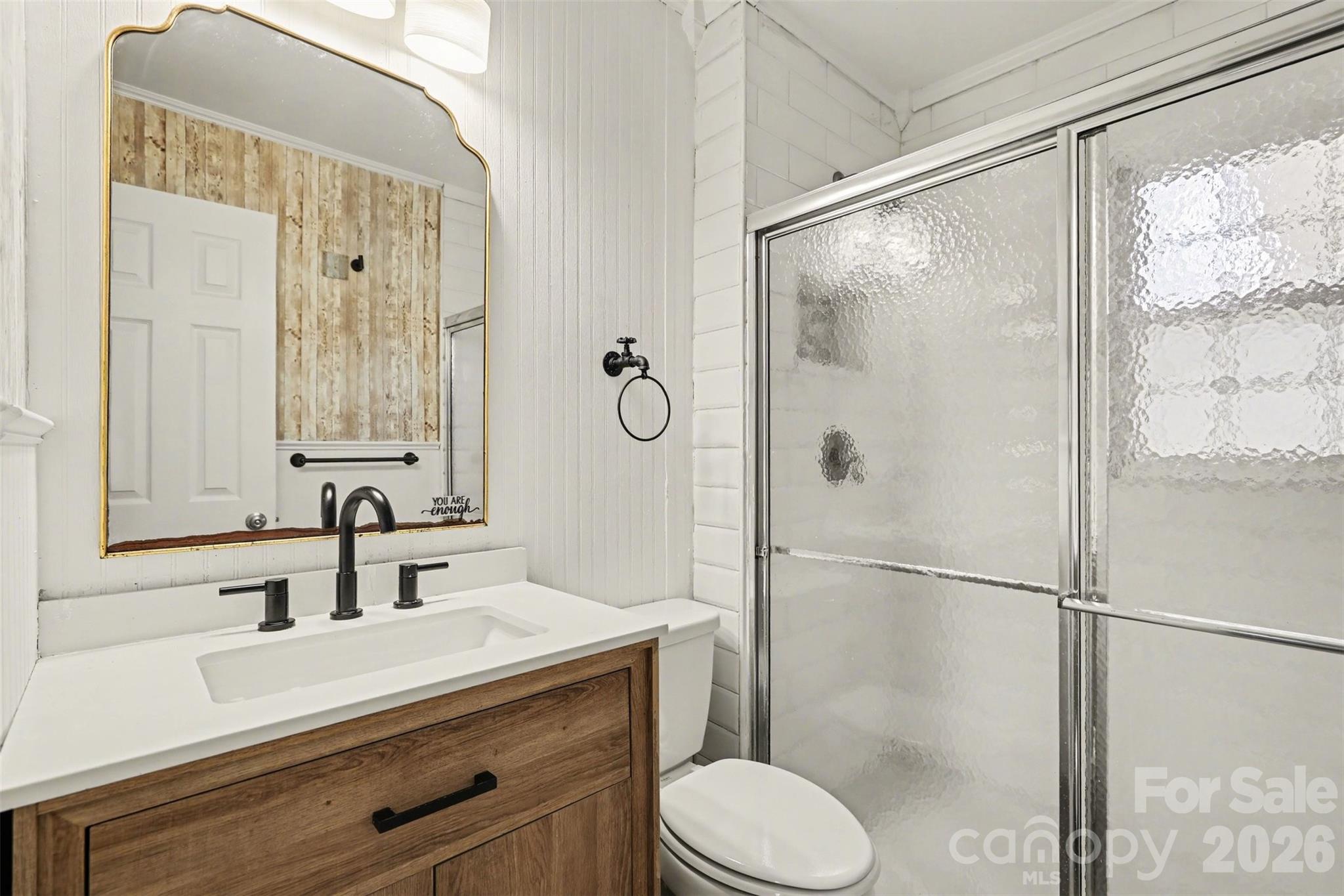 614 North Rhyne Street Gastonia, NC 28054 - Photo 15 of 29 a bathroom with a shower sink vanity mirror and toilet