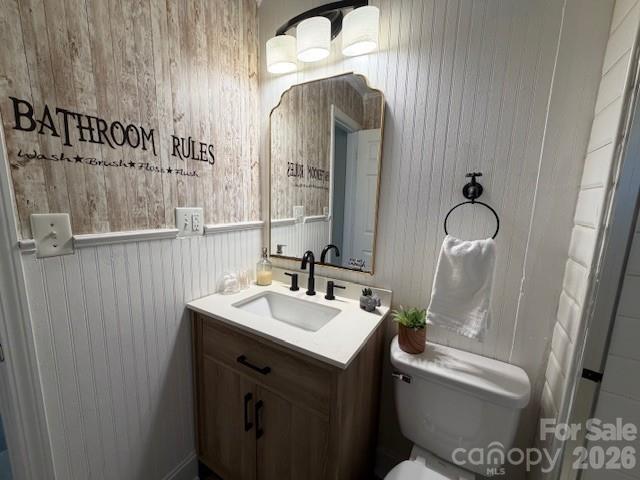 614 North Rhyne Street Gastonia, NC 28054 - Photo 16 of 29 a bathroom with a sink and mirror with toilet