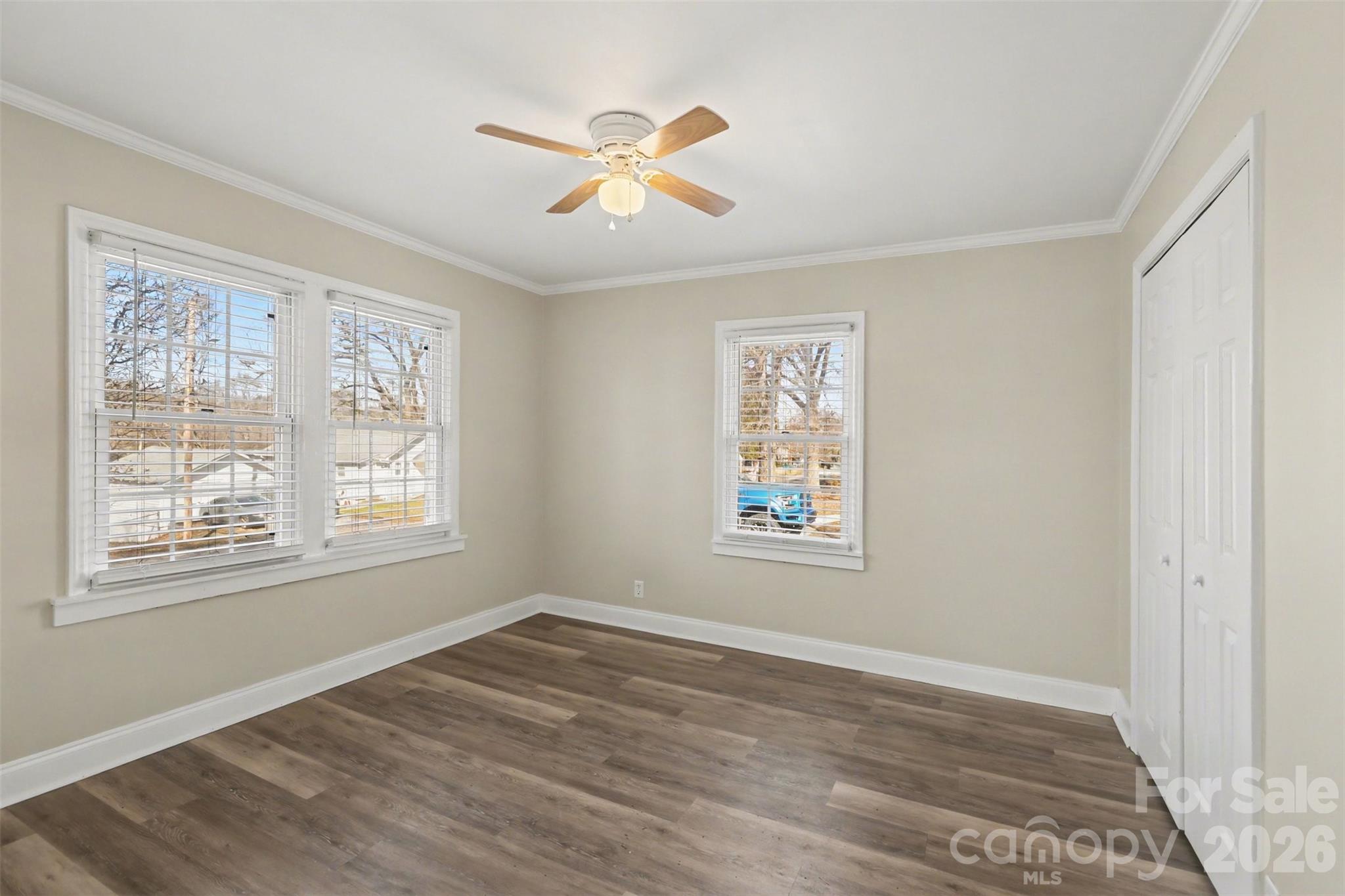 614 North Rhyne Street Gastonia, NC 28054 - Photo 18 of 29 a view of an empty room with a window and wooden floor