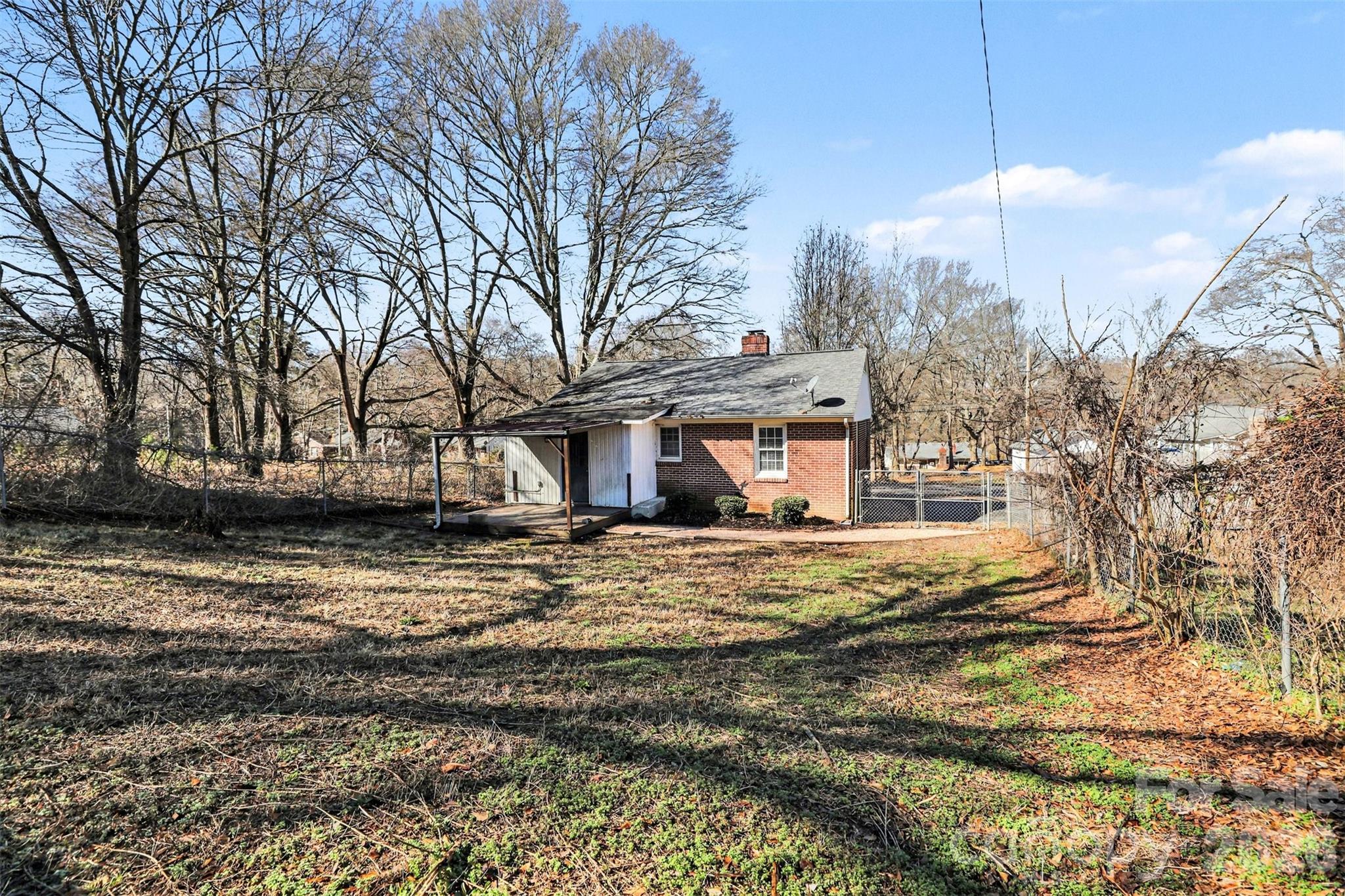 614 North Rhyne Street Gastonia, NC 28054 - Photo 24 of 29 a view of a house with a snow on the road