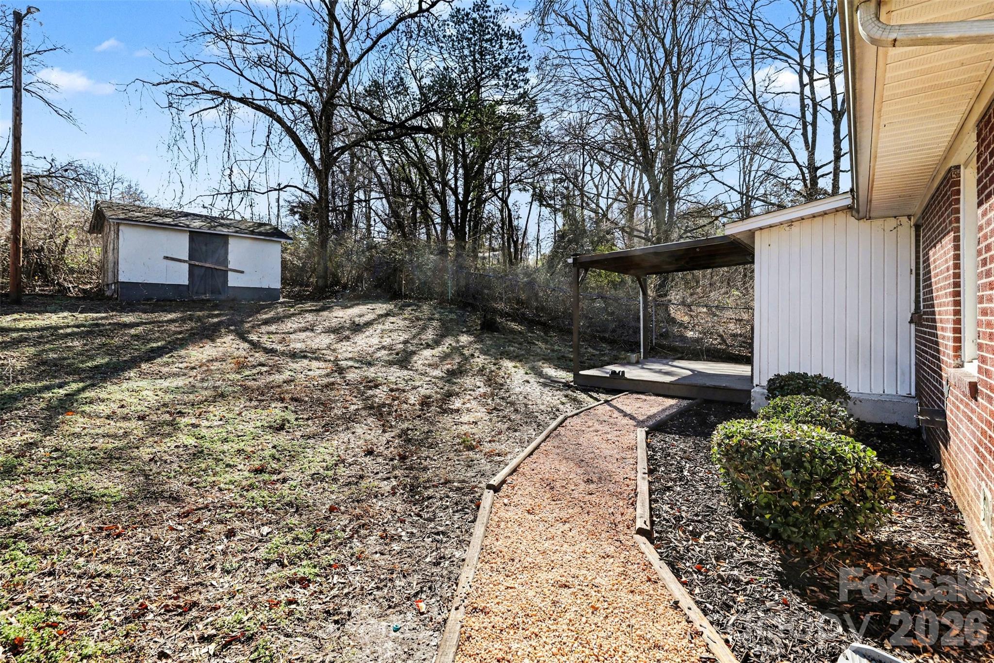 614 North Rhyne Street Gastonia, NC 28054 - Photo 26 of 29 a backyard of a house with lots of green space