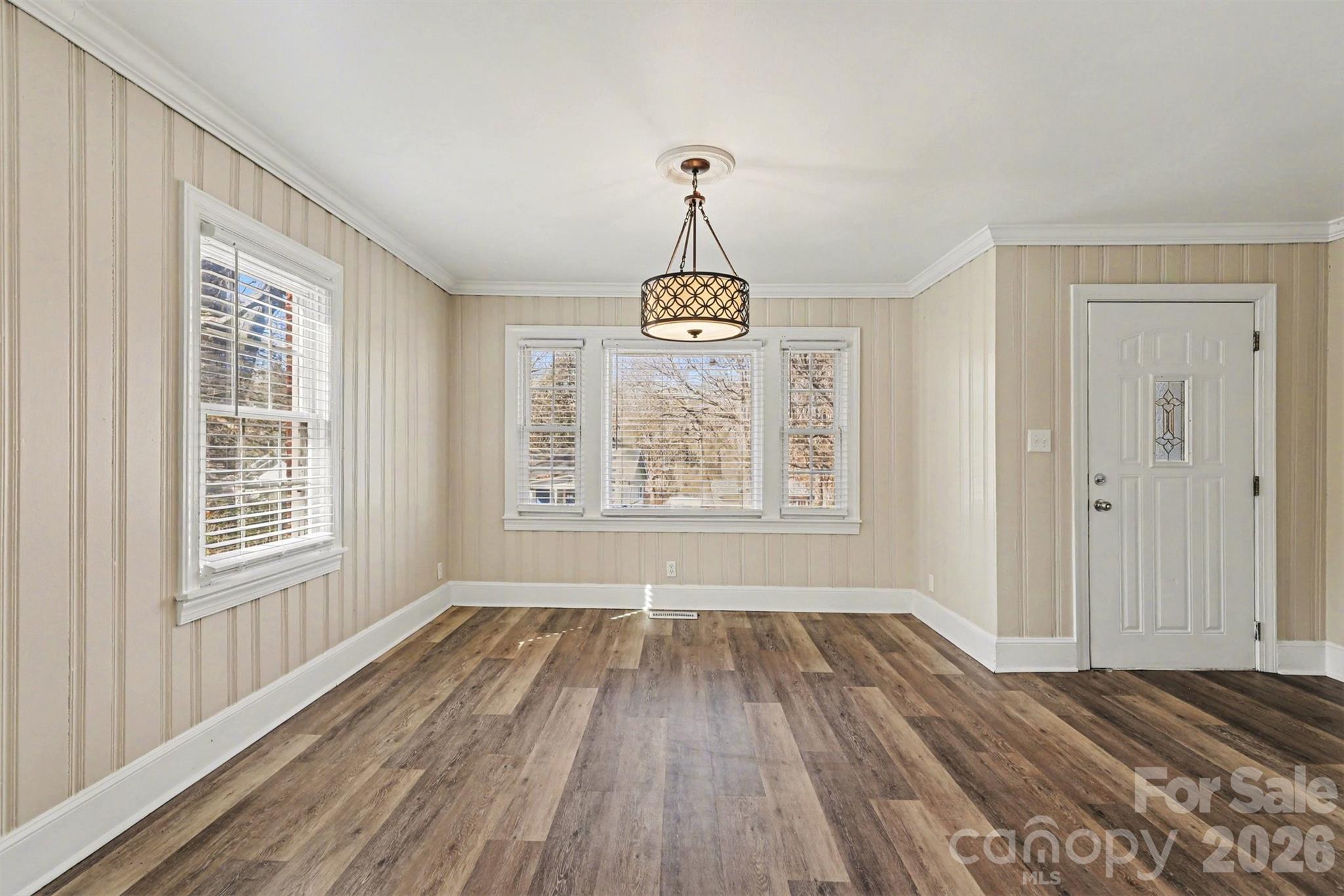 614 North Rhyne Street Gastonia, NC 28054 - Photo 5 of 29 a view of an empty room with wooden floor and window