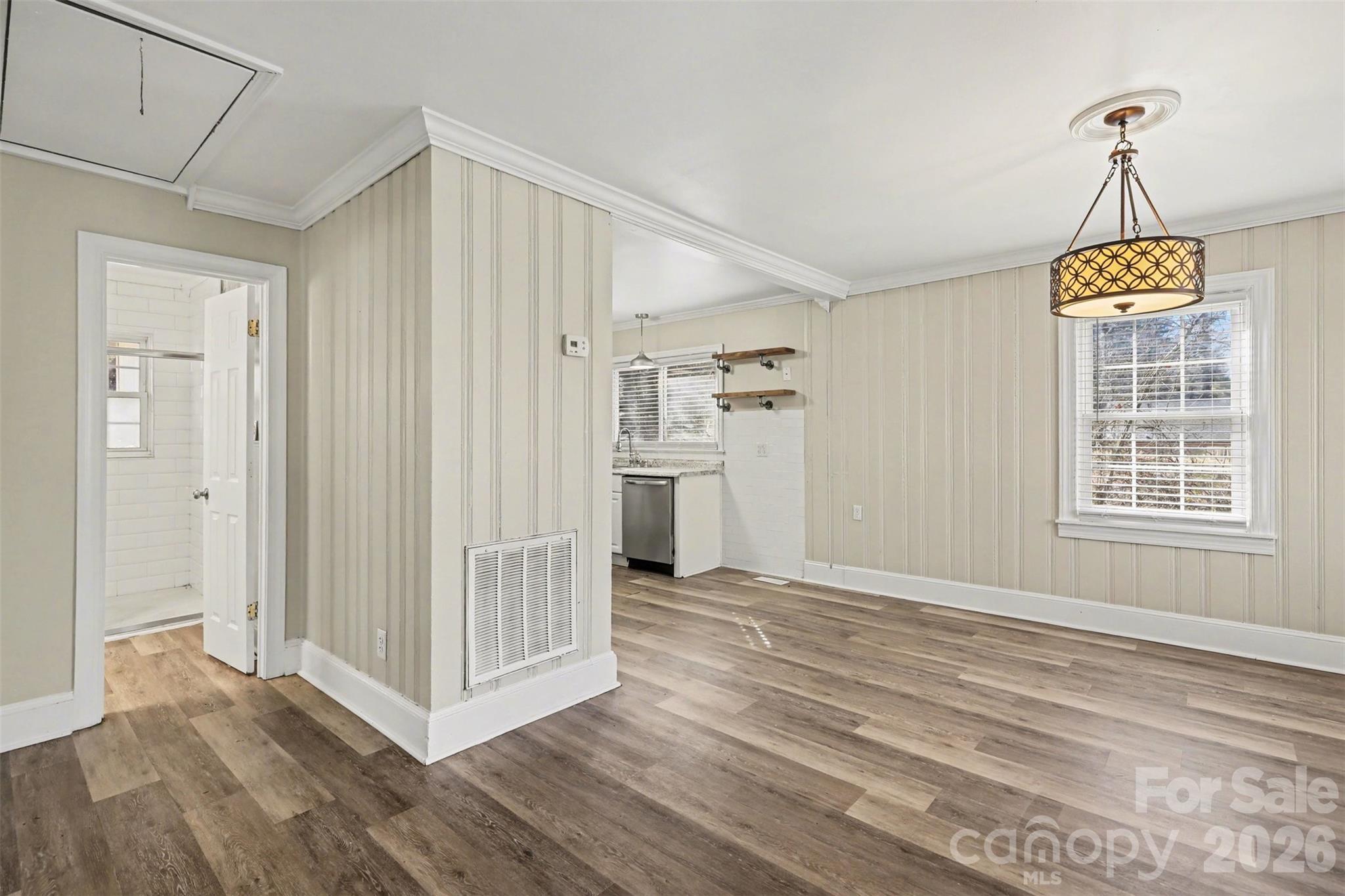 614 North Rhyne Street Gastonia, NC 28054 - Photo 7 of 29 a view of empty room with wooden floor and windows
