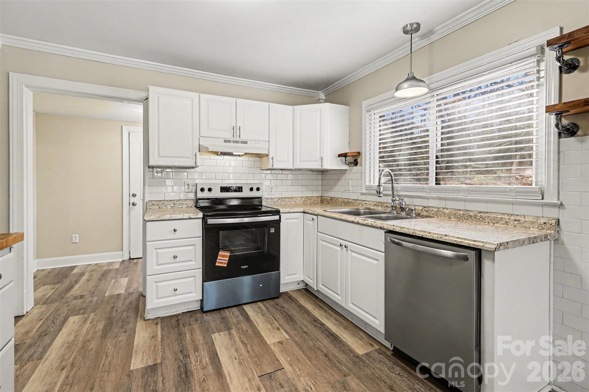 614 North Rhyne Street Gastonia, NC 28054 - Photo 8 of 29 a kitchen with stainless steel appliances granite countertop a stove and a sink