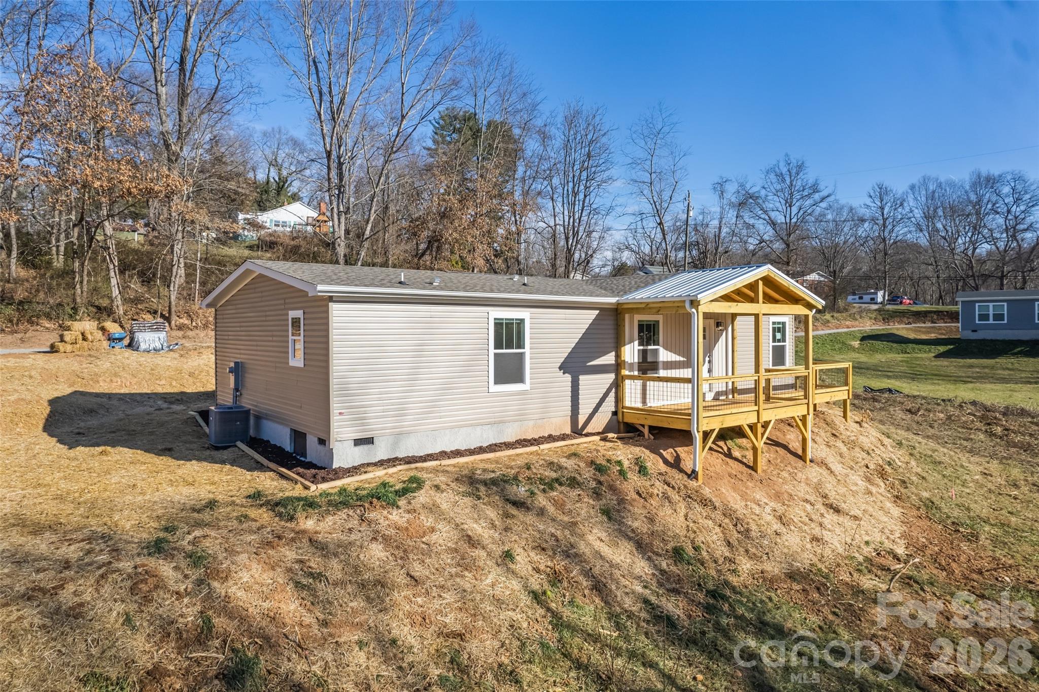 77 Geiranger Drive Clyde, NC 28721 - Photo 11 of 29 a house with trees in the background