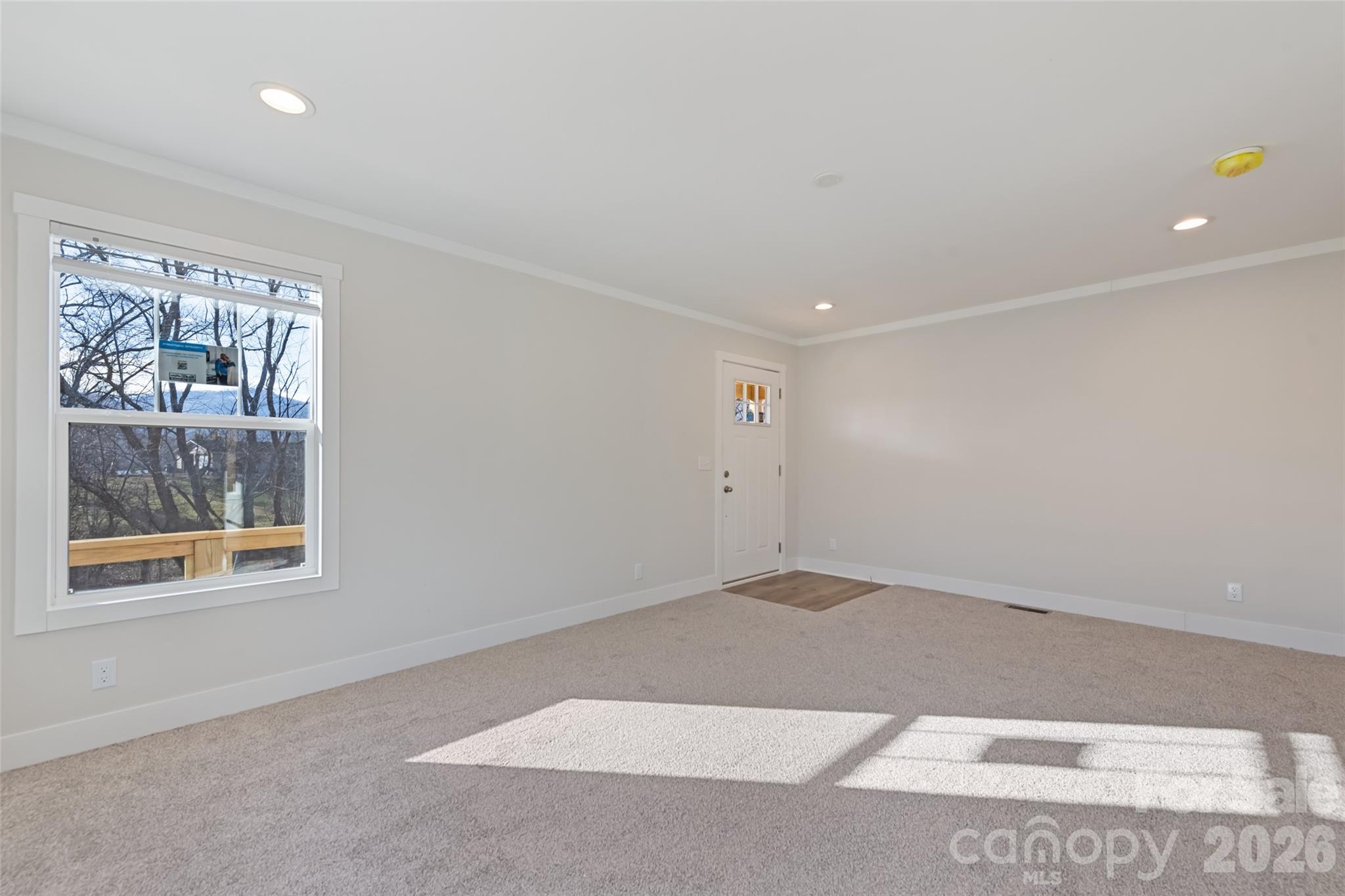 77 Geiranger Drive Clyde, NC 28721 - Photo 15 of 29 an empty room with windows