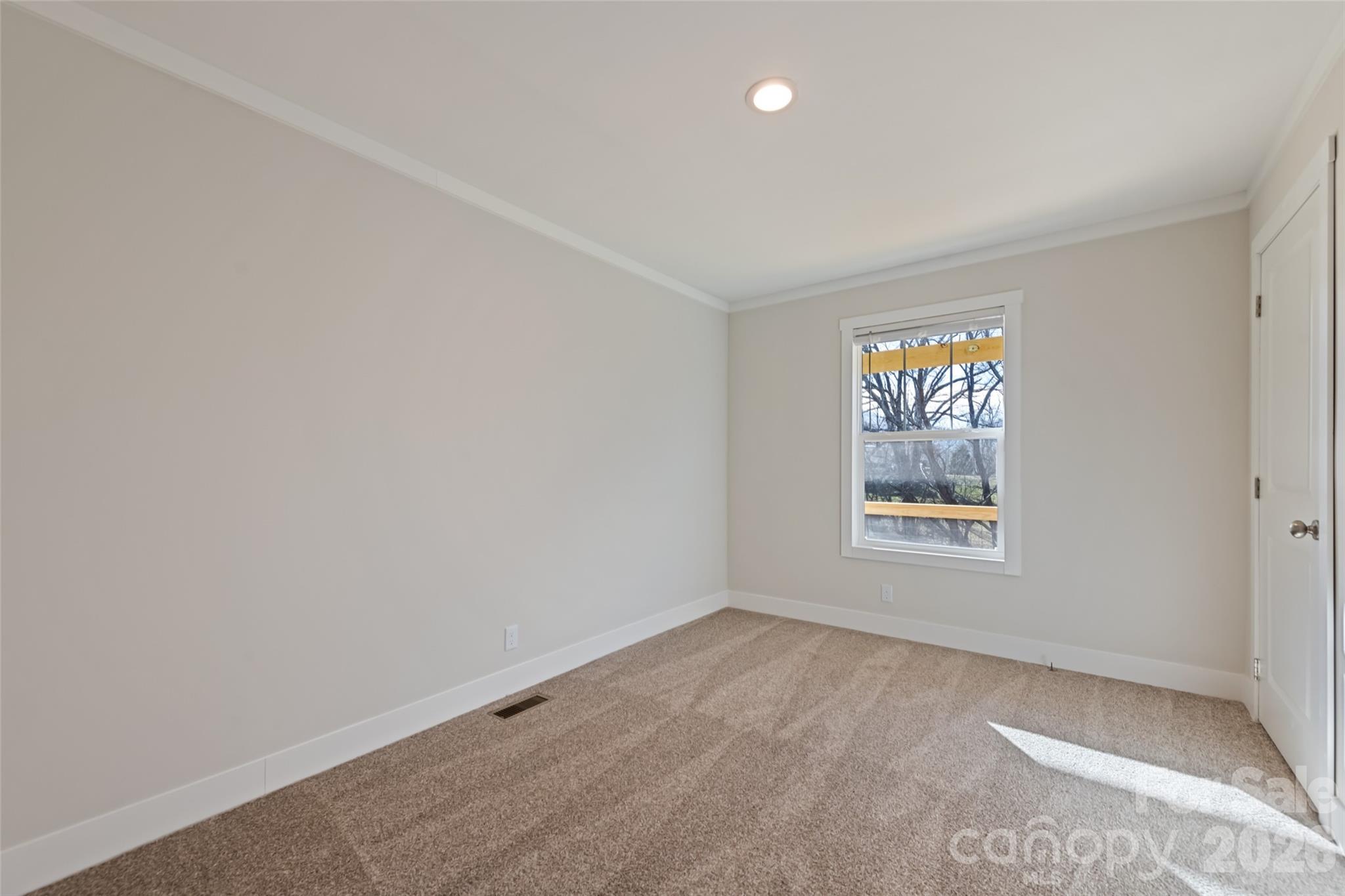 77 Geiranger Drive Clyde, NC 28721 - Photo 17 of 29 an empty room with a window