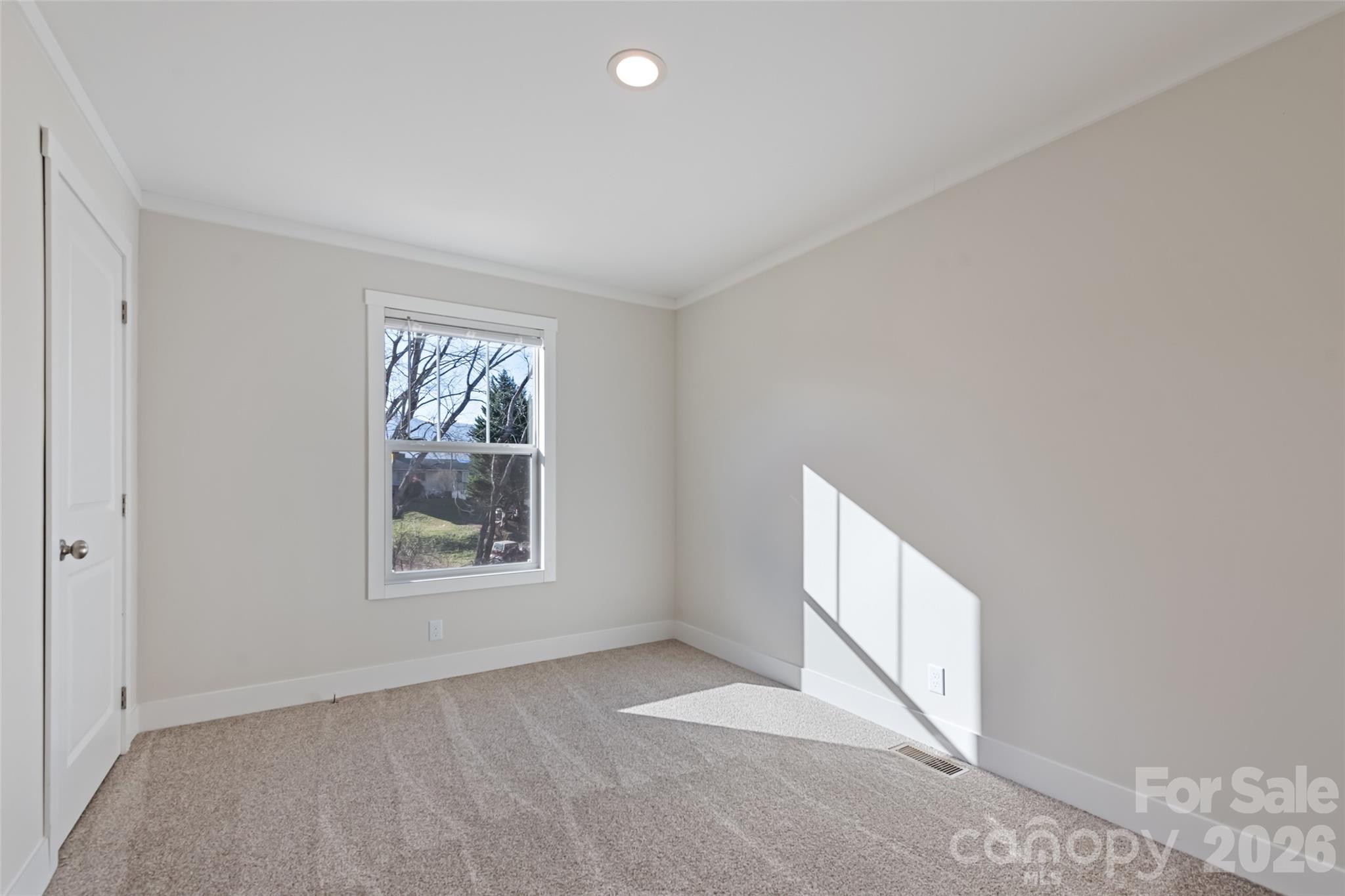 77 Geiranger Drive Clyde, NC 28721 - Photo 20 of 29 a view of an empty room with a window
