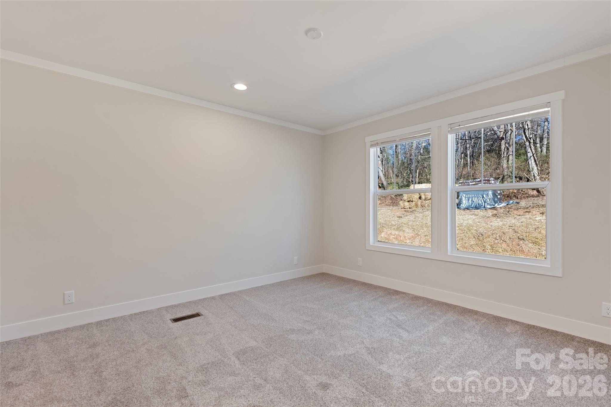 77 Geiranger Drive Clyde, NC 28721 - Photo 22 of 29 an empty room with windows