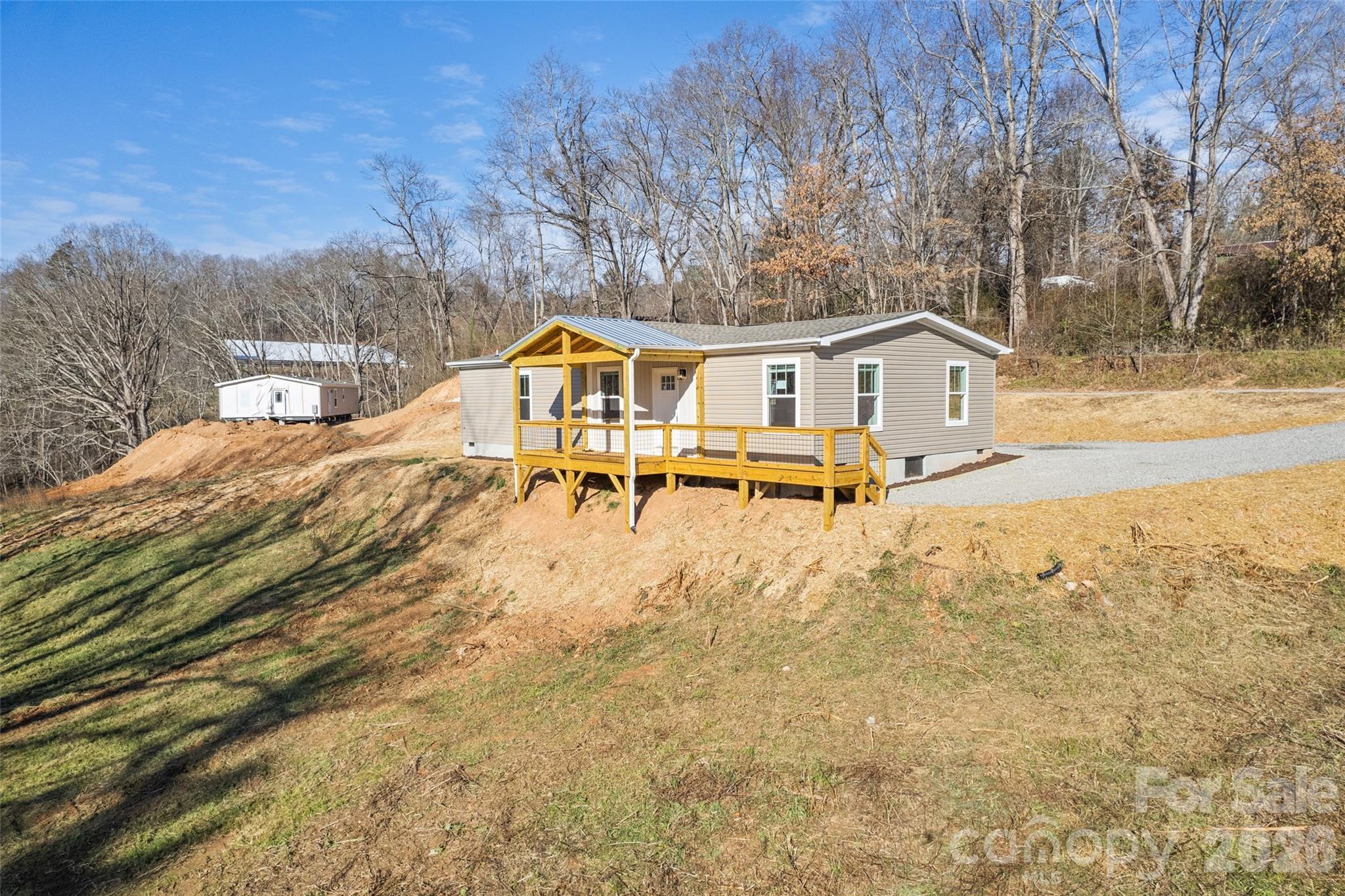 77 Geiranger Drive Clyde, NC 28721 - Photo 26 of 29 a view of a house with a yard