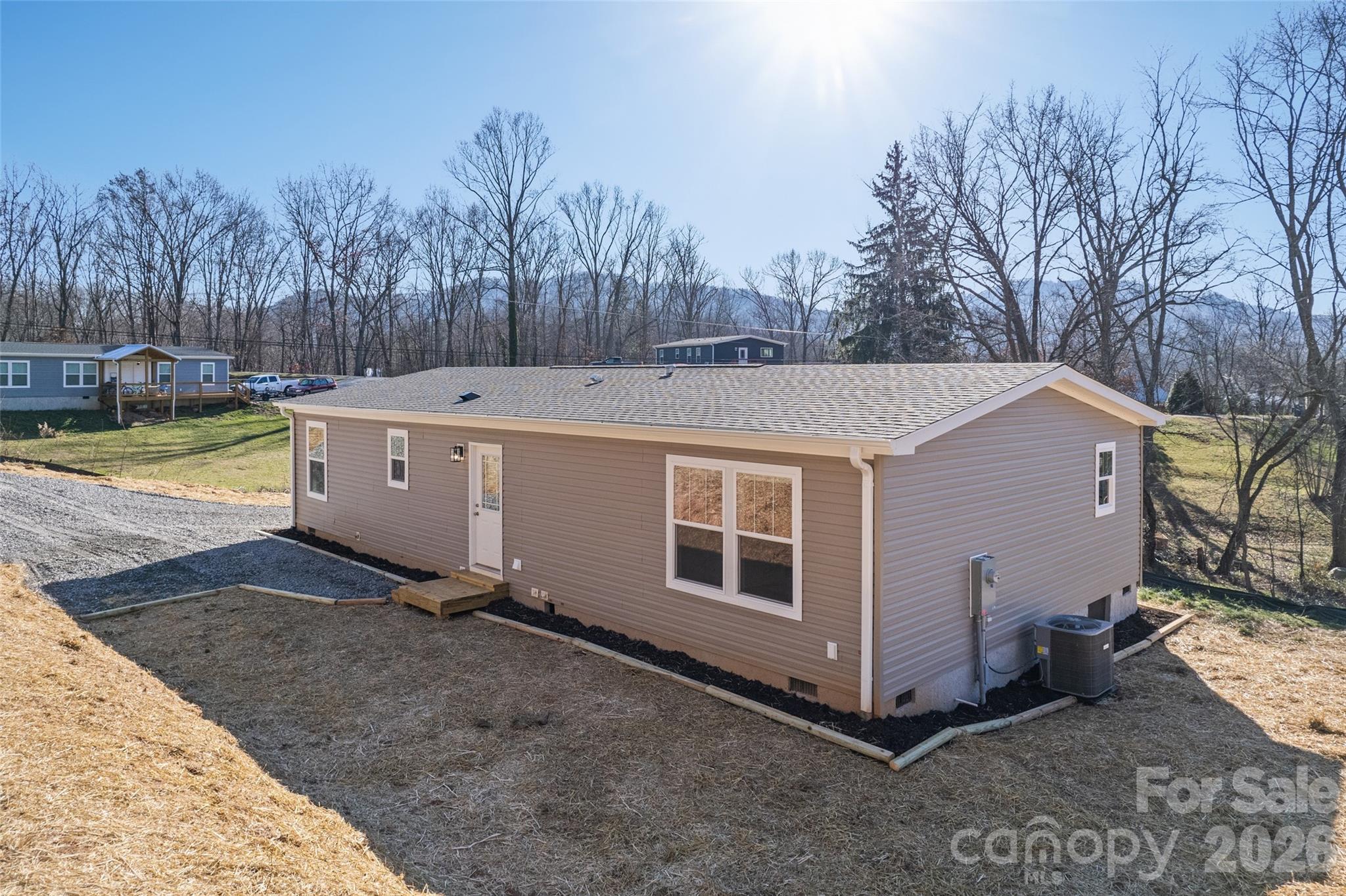 77 Geiranger Drive Clyde, NC 28721 - Photo 28 of 29 a view of a house with backyard