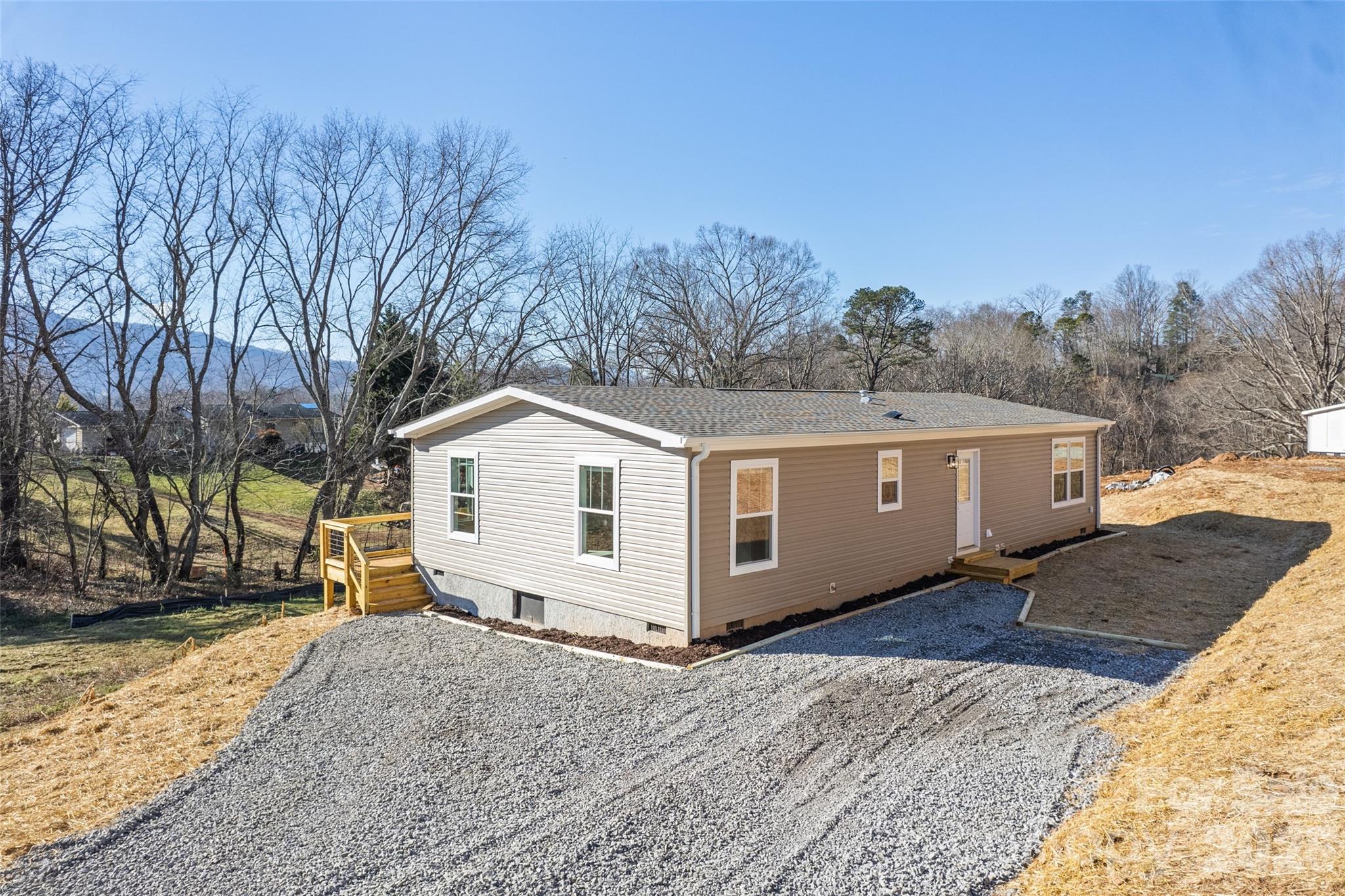 77 Geiranger Drive Clyde, NC 28721 - Photo 29 of 29 a front view of a house with a yard