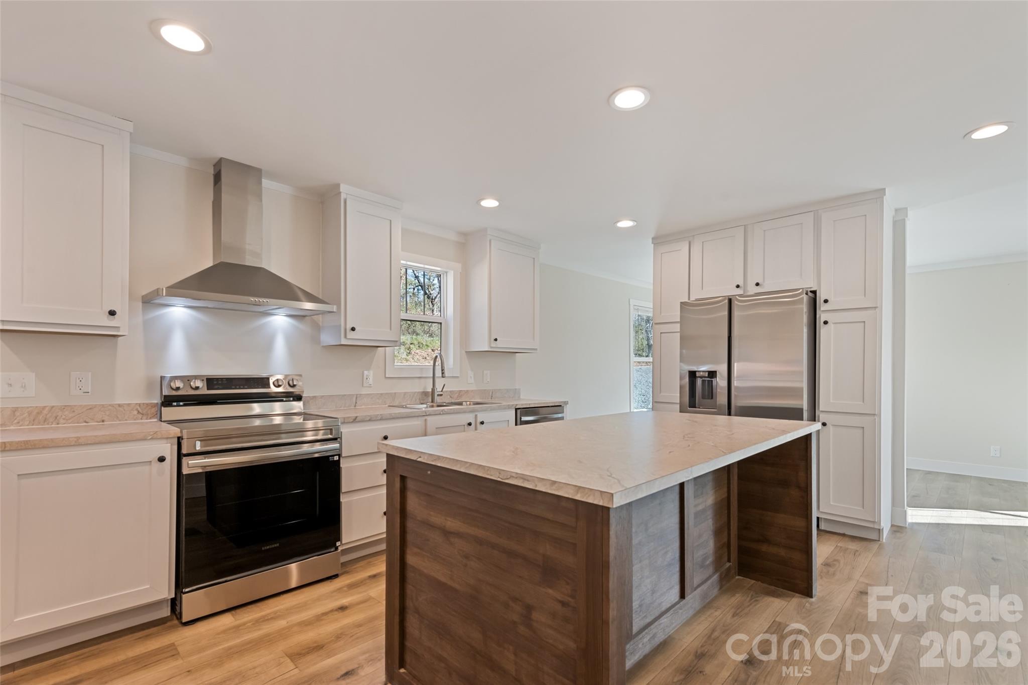 77 Geiranger Drive Clyde, NC 28721 - Photo 7 of 29 a kitchen with a stove a sink and a refrigerator