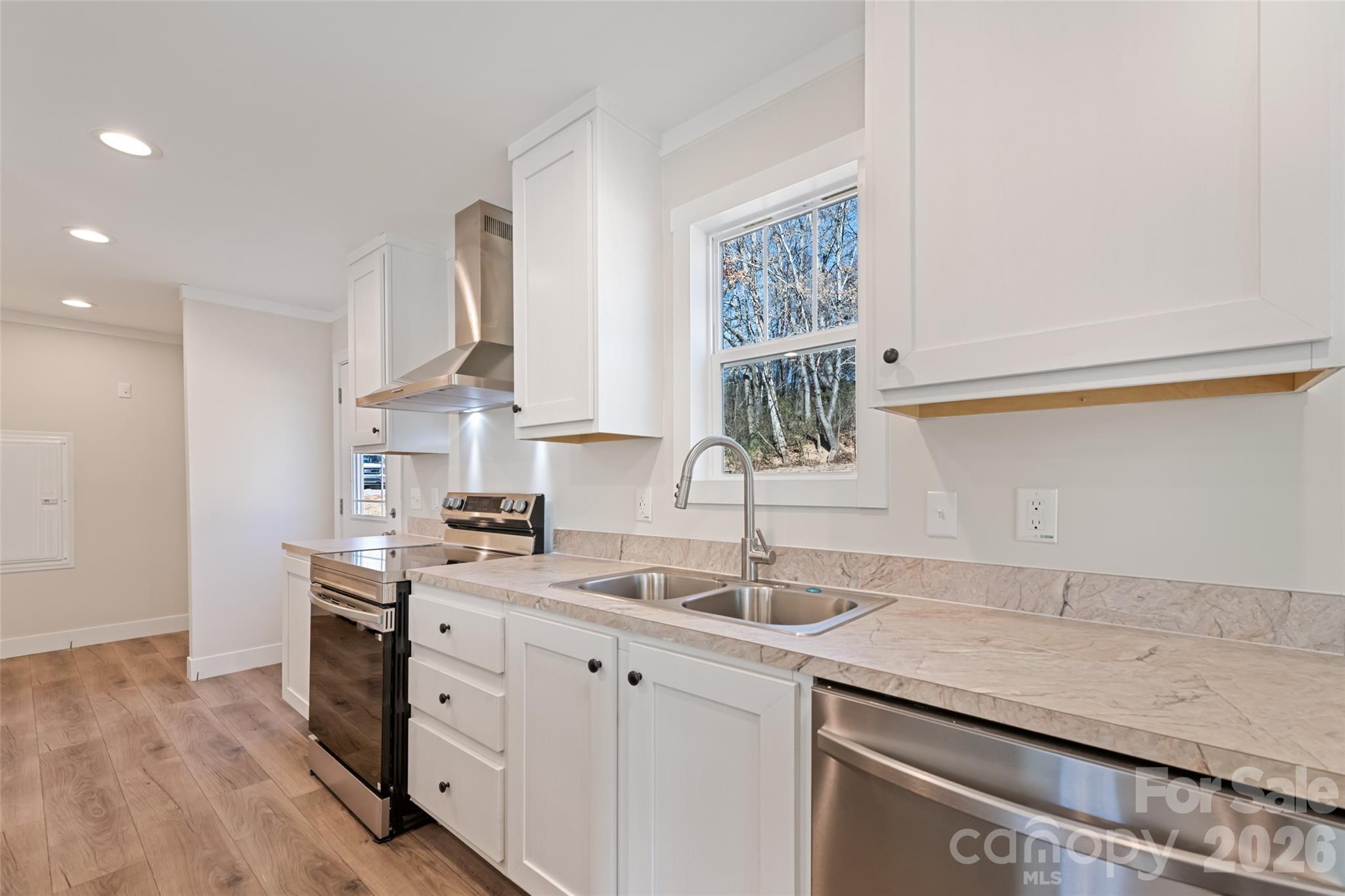 77 Geiranger Drive Clyde, NC 28721 - Photo 8 of 29 a kitchen with a sink cabinets and window