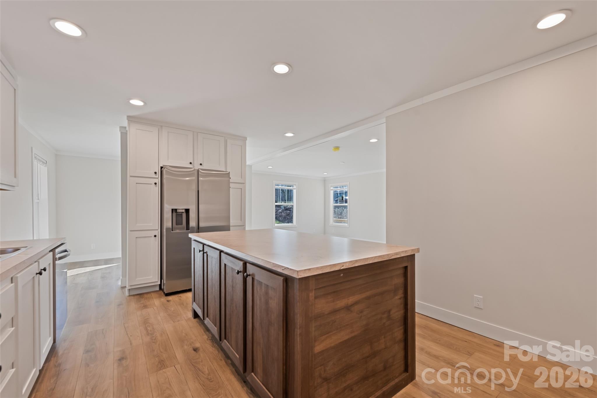 77 Geiranger Drive Clyde, NC 28721 - Photo 10 of 29 a kitchen with stainless steel appliances granite countertop a refrigerator a sink and wooden floor