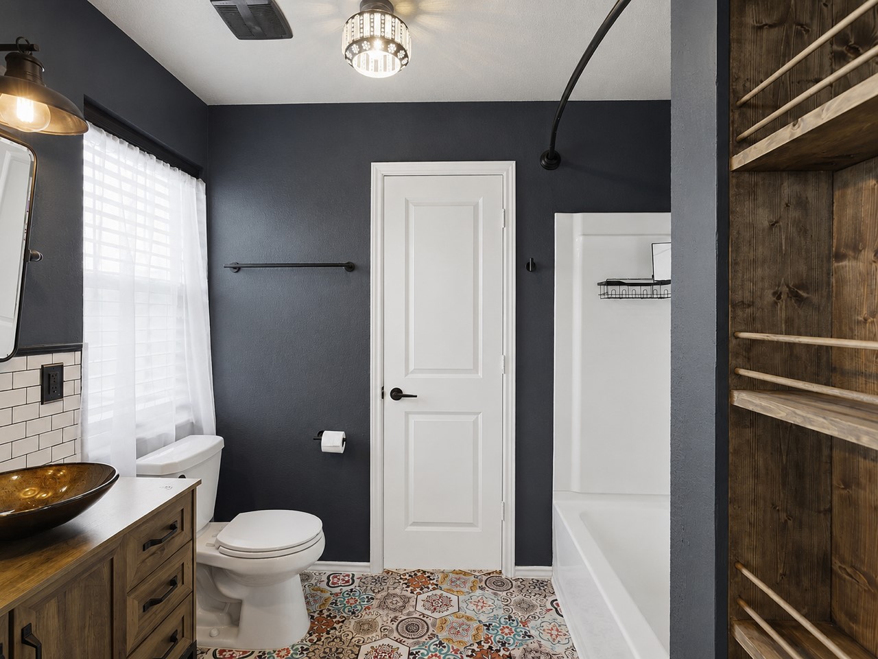 116 Night Riders Way Jarrell, TX 76537 - Photo 21 of 38 Vibrant patterned tile flooring defines this modern bathroom, featuring a vessel sink and full shower.