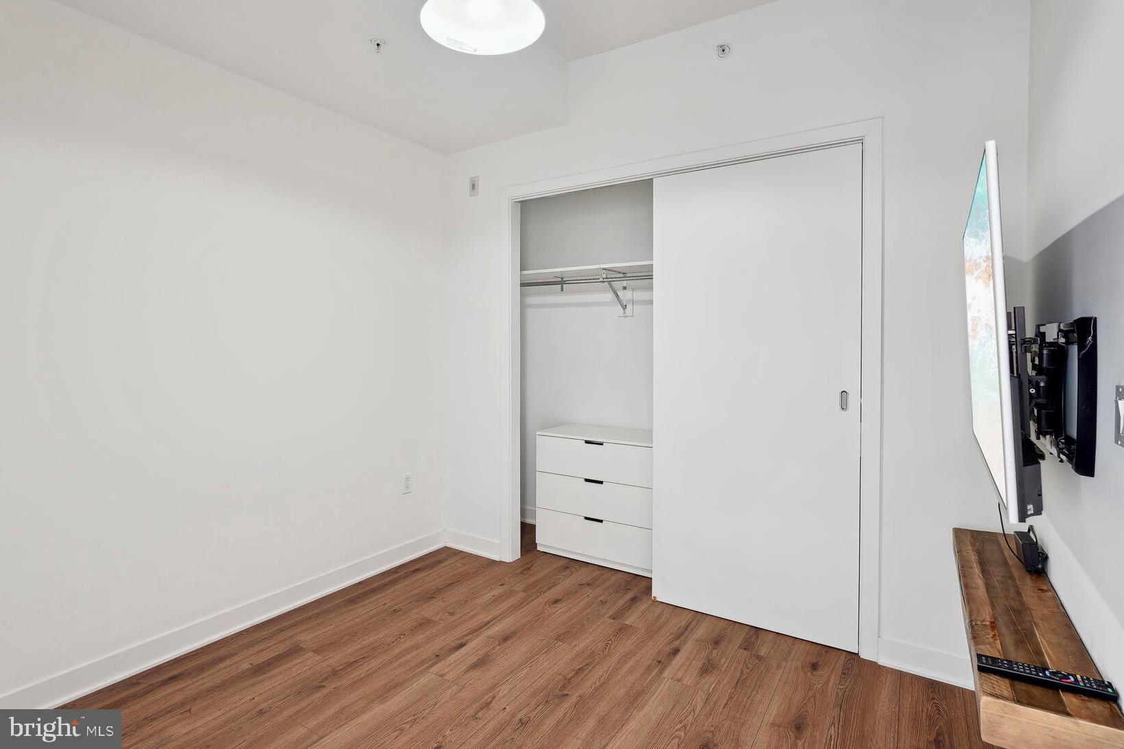 2030 8th Street Northwest, Unit PH5 Washington, DC 20001 - Photo 9 of 18 Bedroom with warm wood floors