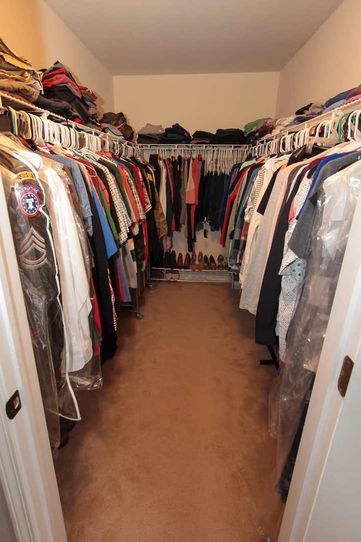 1474 Knotty Pine Drive Elgin, IL 60123 - Photo 14 of 21 a view of walk in closet with clothes and shoes