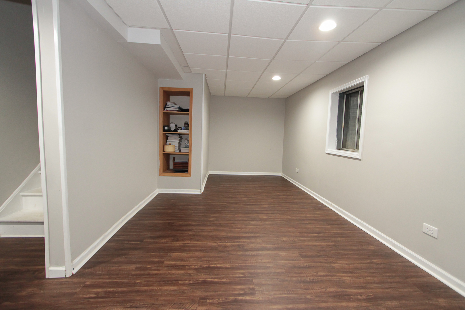 1474 Knotty Pine Drive Elgin, IL 60123 - Photo 19 of 21 a view of an empty room with wooden floor and a window
