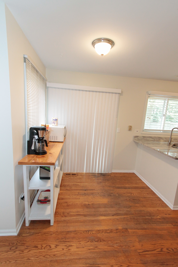 1474 Knotty Pine Drive Elgin, IL 60123 - Photo 7 of 21 a view of a workspace with furniture and window