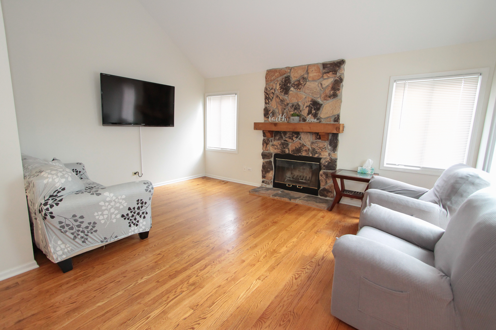 1474 Knotty Pine Drive Elgin, IL 60123 - Photo 8 of 21 a living room with furniture and a flat screen tv
