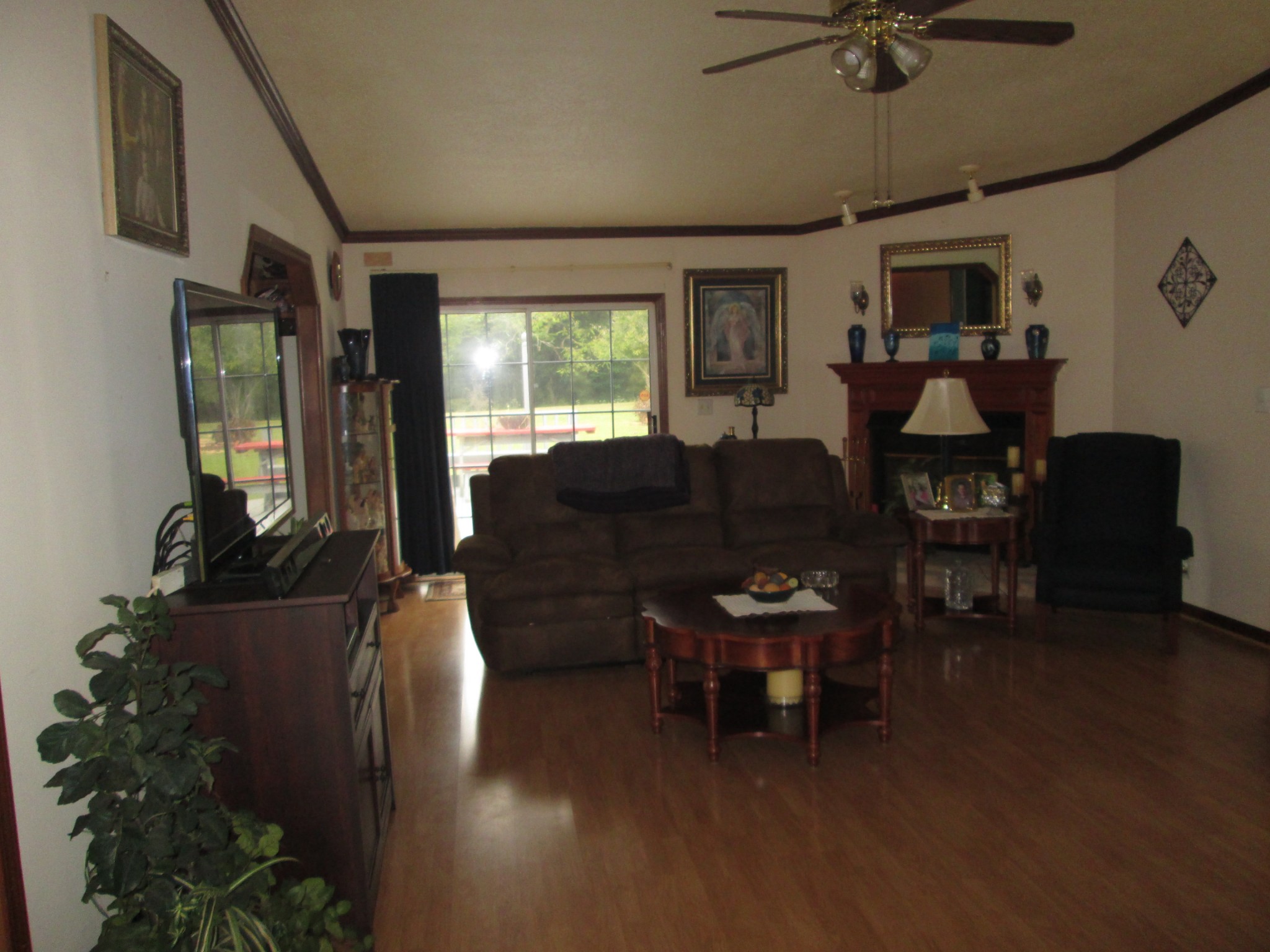 2300 Callis Road Lebanon, TN 37090 - Photo 4 of 21 a living room with furniture a flat screen tv and a large window